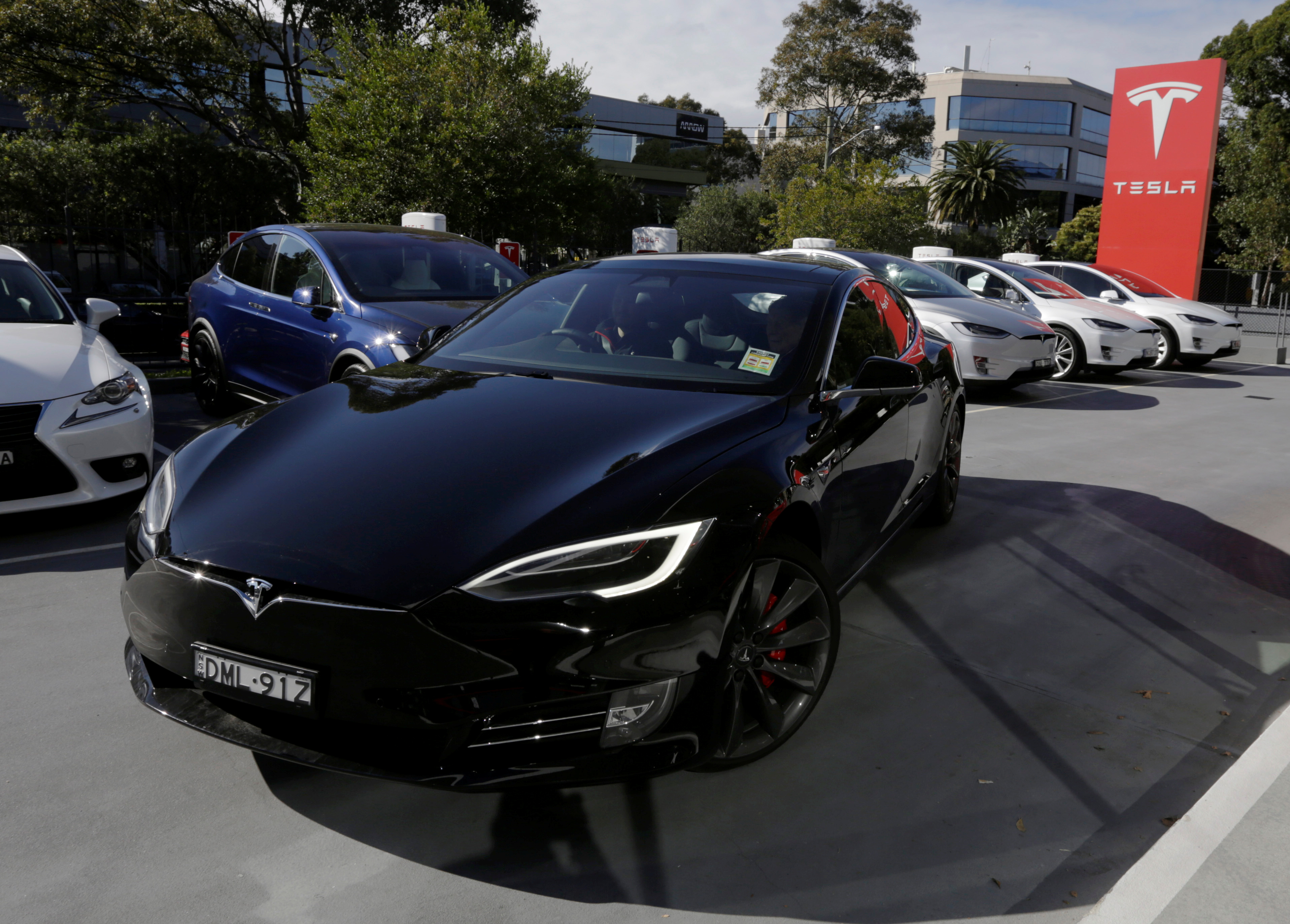 A Tesla Model S electric car is taken for a test drive at a Tesla car dealership in Sydney