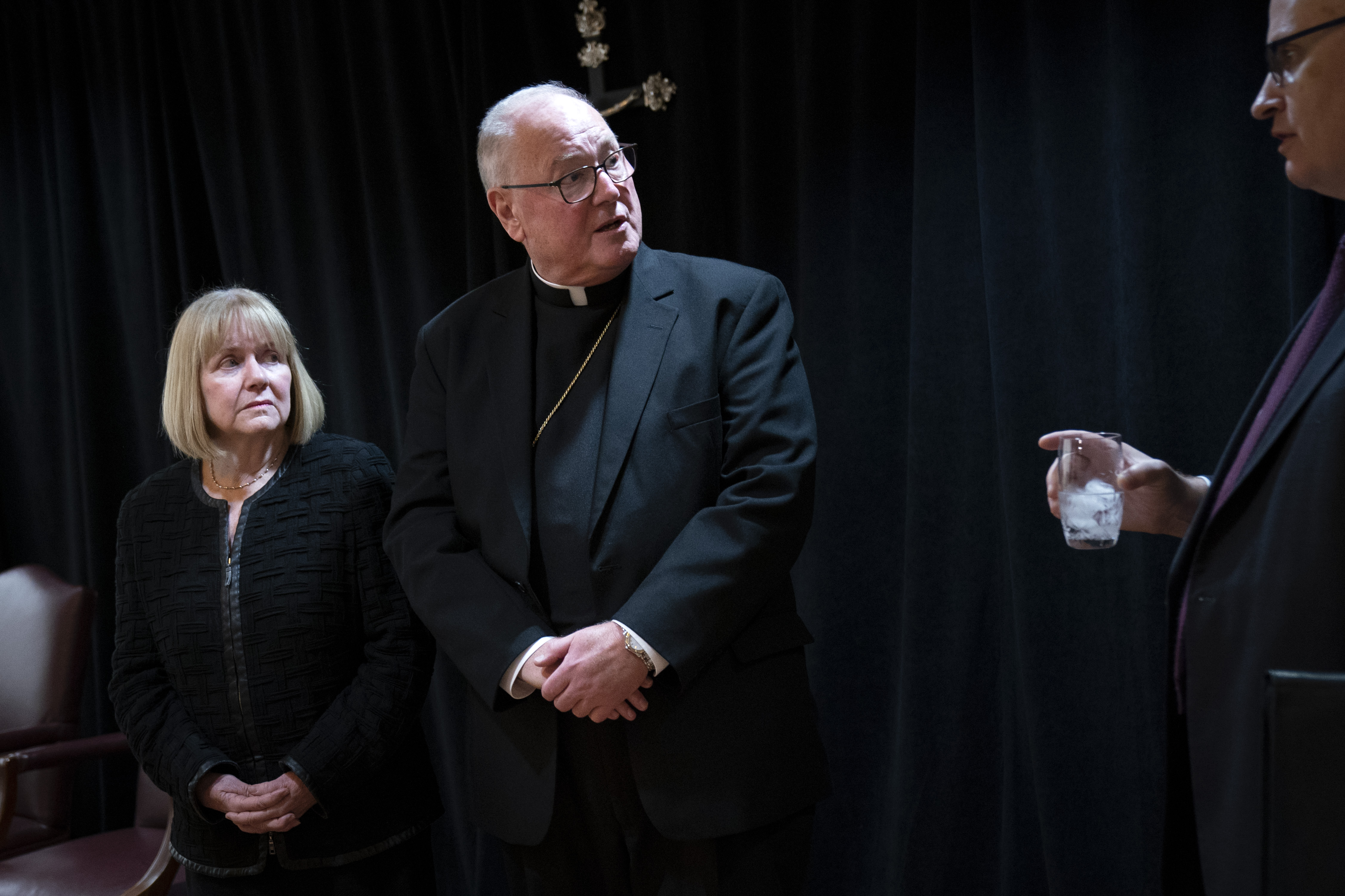 NEW YORK, NY - SEPTEMBER 20: (L-R) Former federal judge Barbara Jones speaks as Cardinal Timothy Dolan, archbishop of New York, prepares to exit following a news conference at the headquarters of the Archdiocese of New York, September 20, 2018 in New York City. Dolan announced that he is appointing Jones, a former judge for the U.S. District Court in the Southern District of New York, to review the Church's procedures and protocols for handling allegations of sexual abuse. (Photo by Drew Angerer/Getty Images)