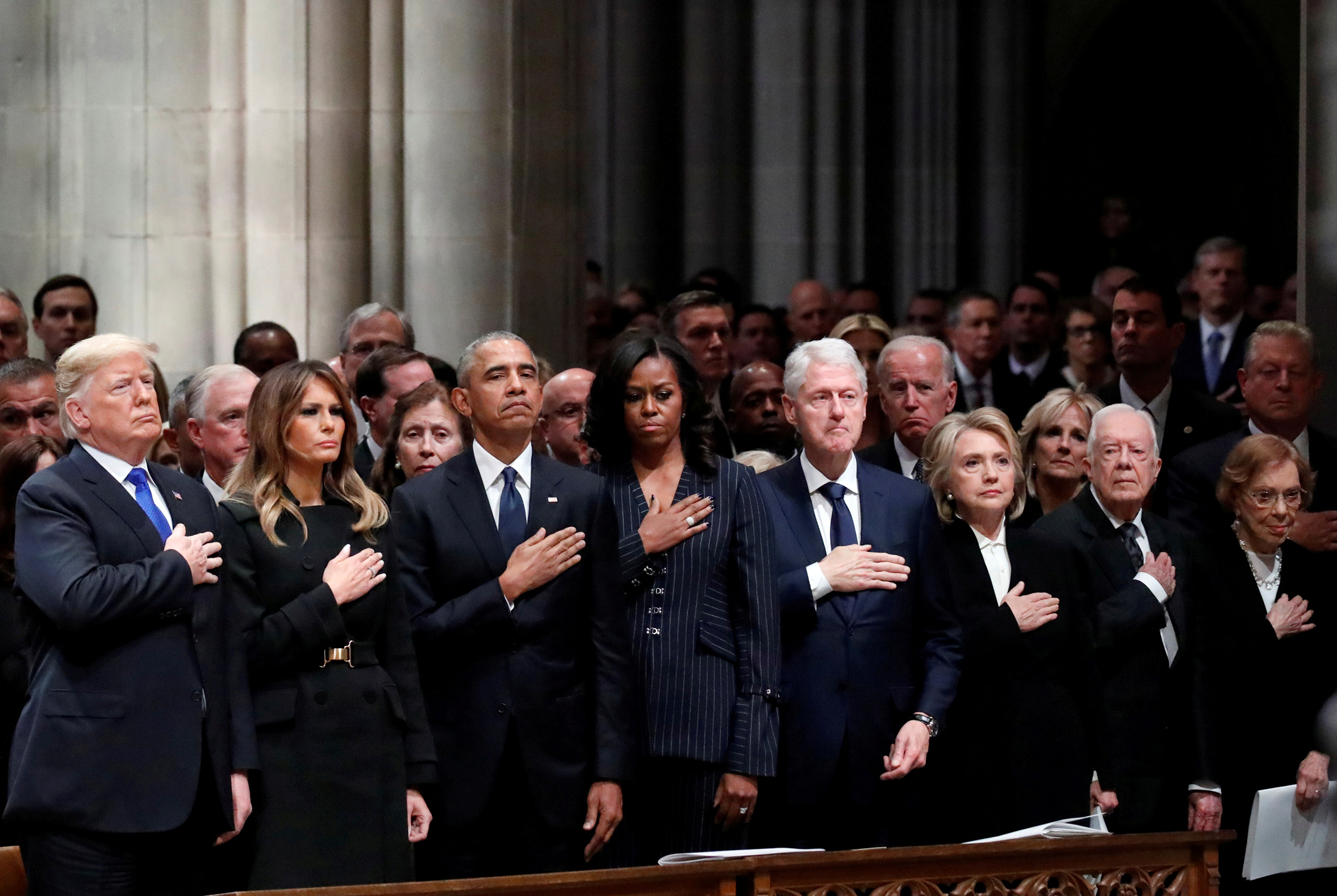 U.S. President Donald Trump, first lady Melania Trump, former President Barack Obama, former first lady Michelle Obama, former President Bill Clinton, former Secretary of State Hillary Clinton, former President Jimmy Carter and former first lady Rosalynn Carter participate in the State Funeral for former President George H.W. Bush, at the National Cathedral, Wednesday, Dec. 5, 2018 in Washington. Alex Brandon/Pool via REUTERS