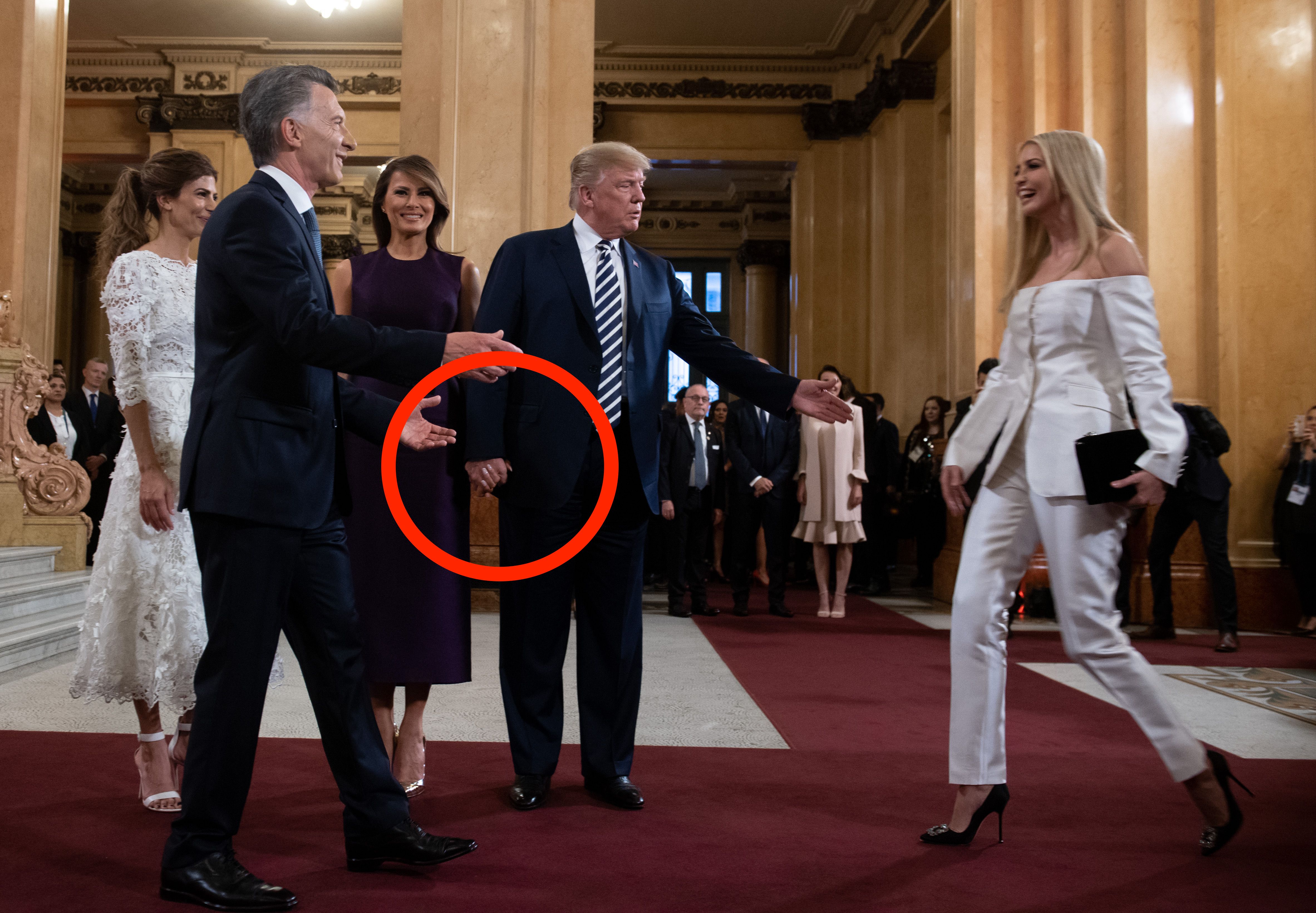 US President Donald Trump (C) calls her daughter White House adviser Ivanka Trump to join her wife US First Lady Melania Trump (3-L), Argentina's President Mauricio Macri (2-L) and his wife Argentina's First Lady Juliana Awada (L), prior to a gala at the Colon Theater in Buenos Aires, on November 30, 2018 in the sidelines of the G20 Leader's Summit. LOEB/AFP/Getty Images