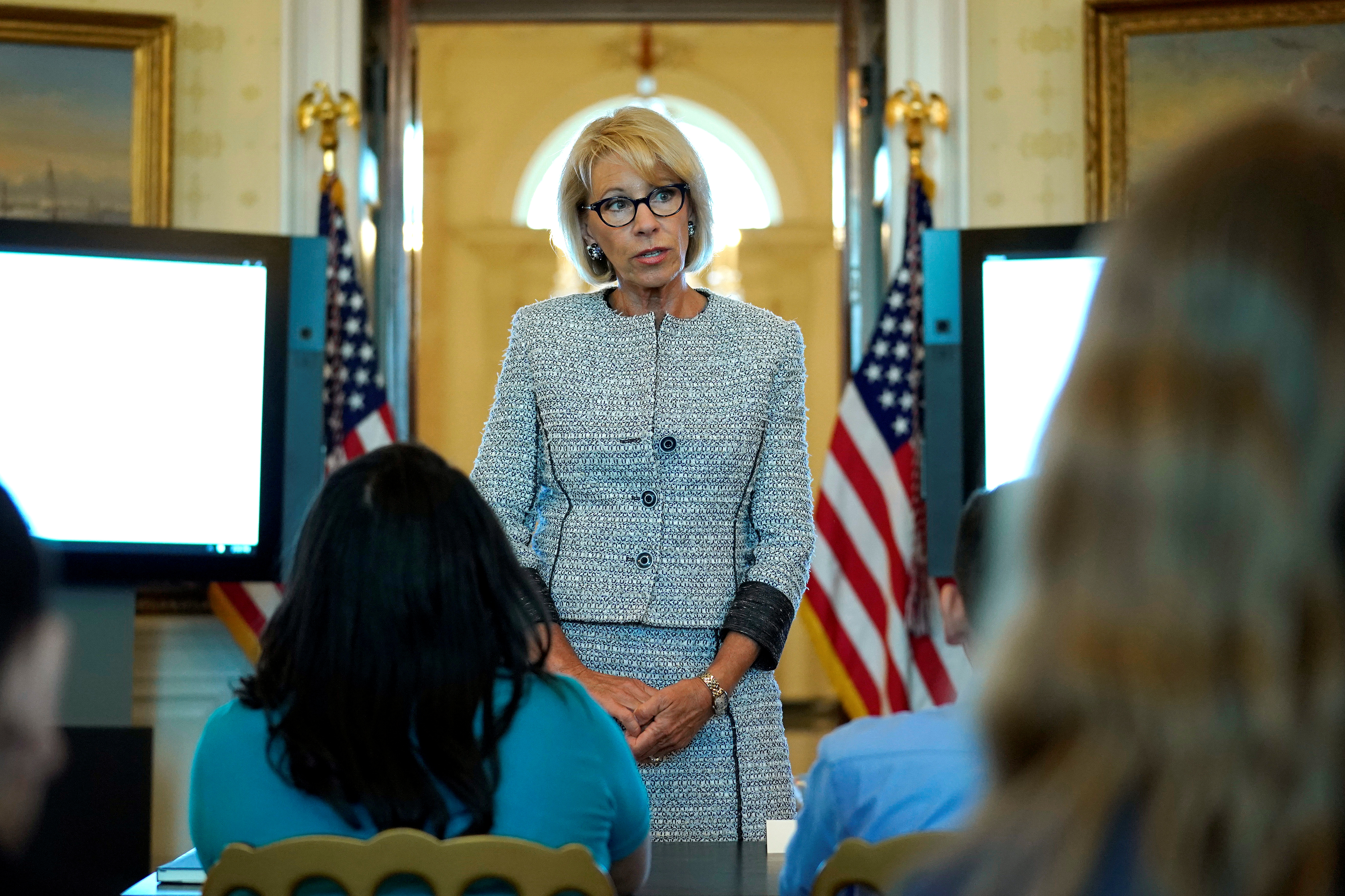 U.S. Secretary of Education Betsy DeVos speaks with school children during a listening session before the arrival of U.S. first lady Melania Trump at the White House in Washington, U.S., April 9, 2018. REUTERS/Joshua Roberts