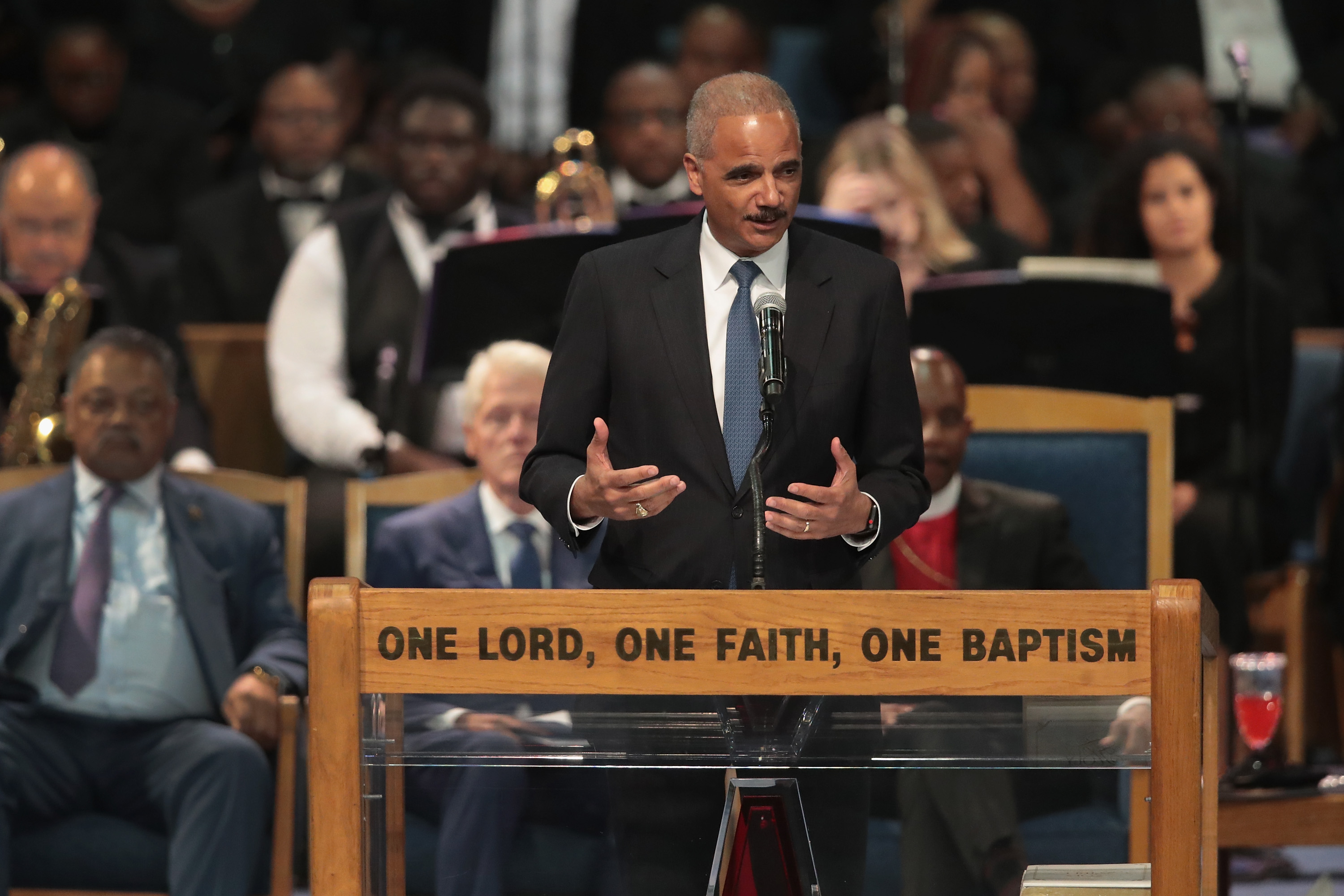 Former U.S. Attorney General Eric Holder speaks at the funeral for Aretha Franklin at the Greater Grace Temple on August 31, 2018 in Detroit, Michigan. (Photo by Scott Olson/Getty Images)