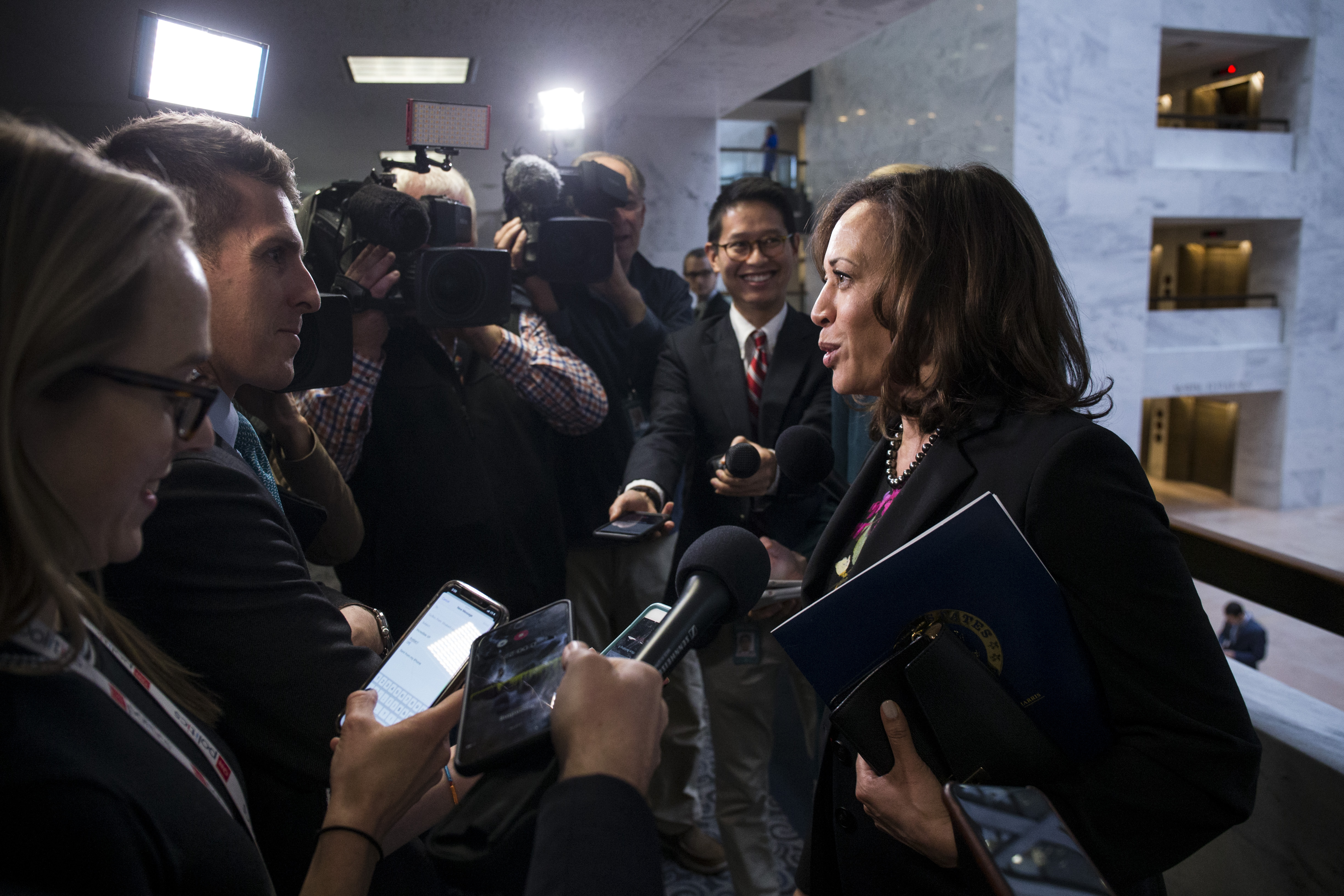 Sen. Kamala Harris speaks to reporters following a closed briefing on intelligence matters on Capitol Hill on December 4, 2018 in Washington, DC. (Photo by Zach Gibson/Getty Images)