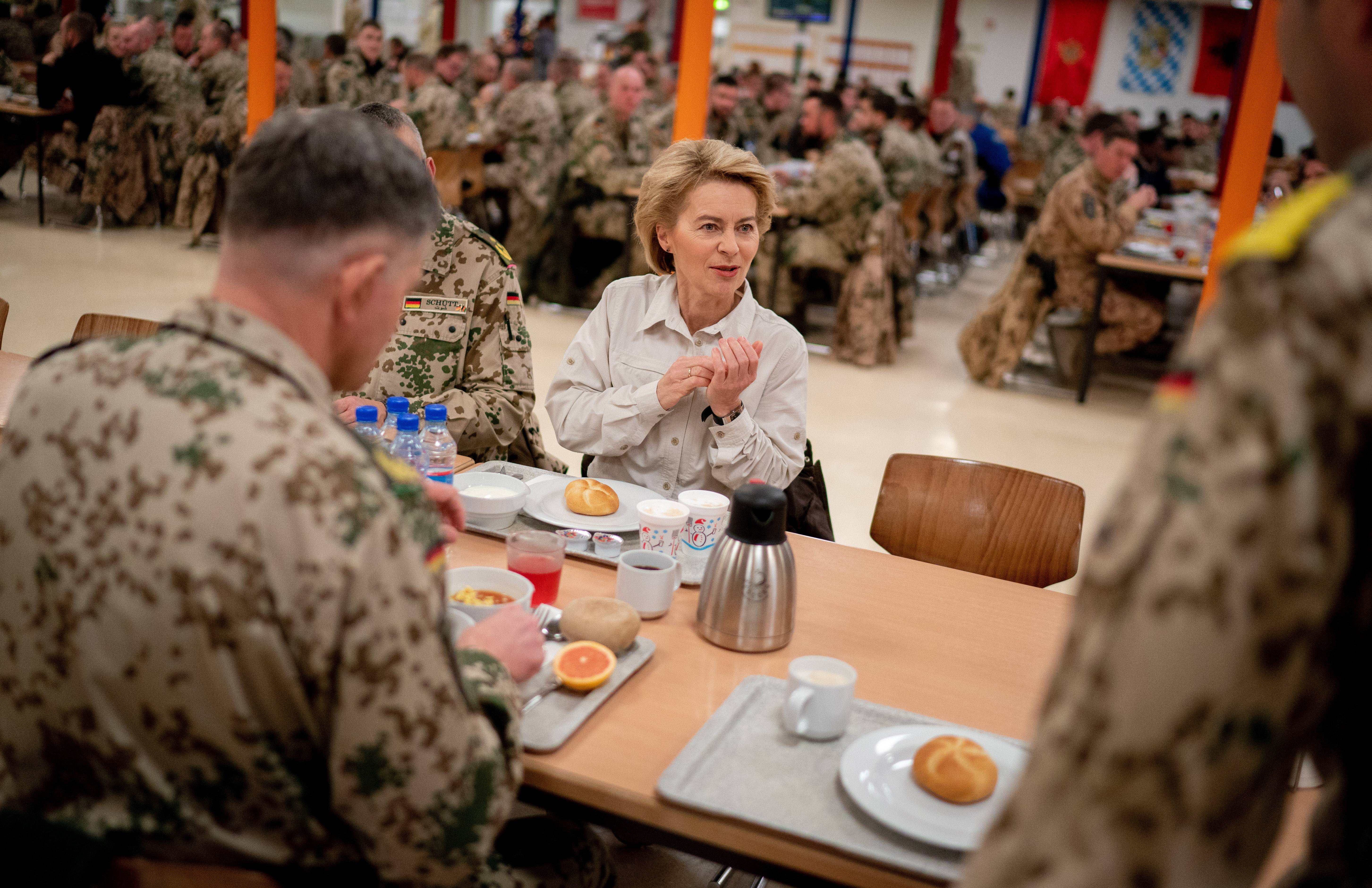 German Defence Minister Ursula von der Leyen has breakfast with German soldiers during her visit on December 18, 2018 at Camp Marmal in Mazar-i-Sharif, Afghanistan. (Photo by Kay Nietfeld / POOL / AFP)