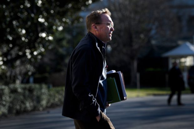 Acting White House Chief of Staff Mick Mulvaney follows US President Donald Trump to Marine One on the South Lawn of the White House January 10, 2019 in Washington, DC. - Trump travels to the US-Mexico border as part of his all-out offensive to build a wall, a day after he stormed out of negotiations when Democratic opponents refused to agree to fund the project in exchange for an end to a painful government shutdown. (Photo by Brendan Smialowski / AFP) (Photo credit should read BRENDAN SMIALOWSKI/AFP/Getty Images)
