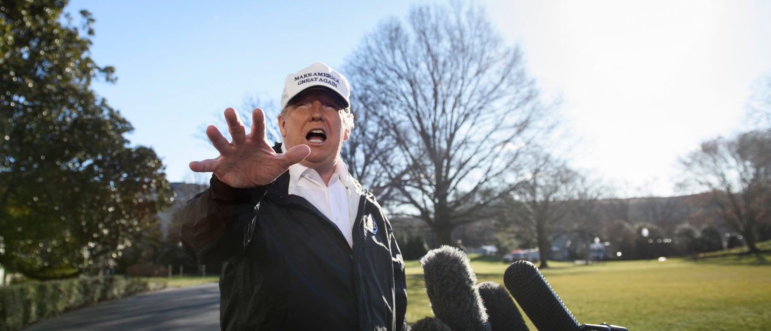 US President Donald Trump speaks to the press as he departs the White House in Washington, DC, on January 10, 2019. - Trump travels to the US-Mexico border as part of his all-out offensive to build a wall, a day after he stormed out of negotiations when Democratic opponents refused to agree to fund the project in exchange for an end to a painful government shutdown. (Photo by BRENDAN SMIALOWSKI/AFP/Getty Images)