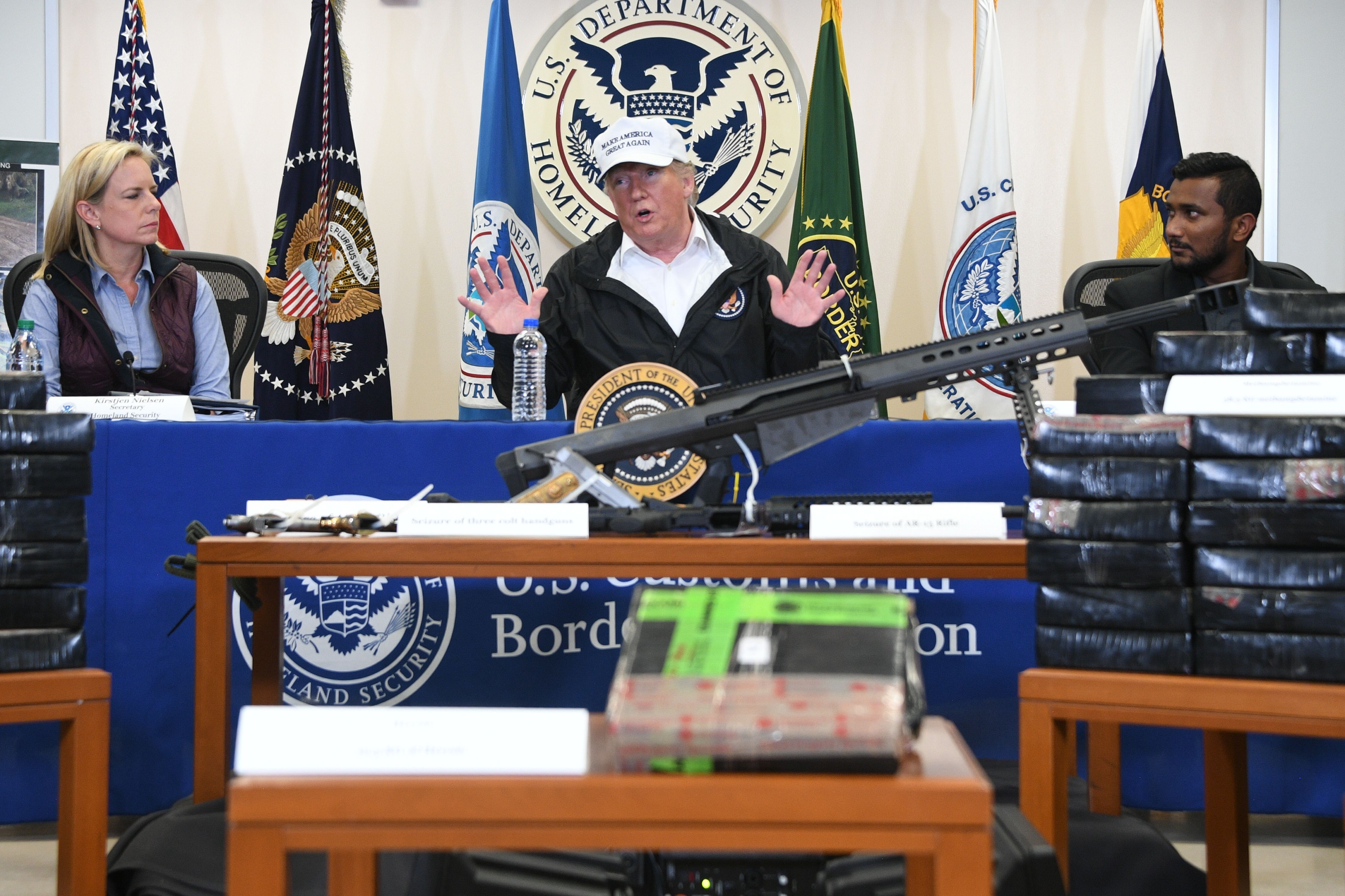US President Donald Trump (C), with Homeland Security Secretary Kirstjen Nielsen (L), speaks during his visit to US Border Patrol McAllen Station in McAllen, Texas, on January 10, 2019. (JIM WATSON/AFP/Getty Images)