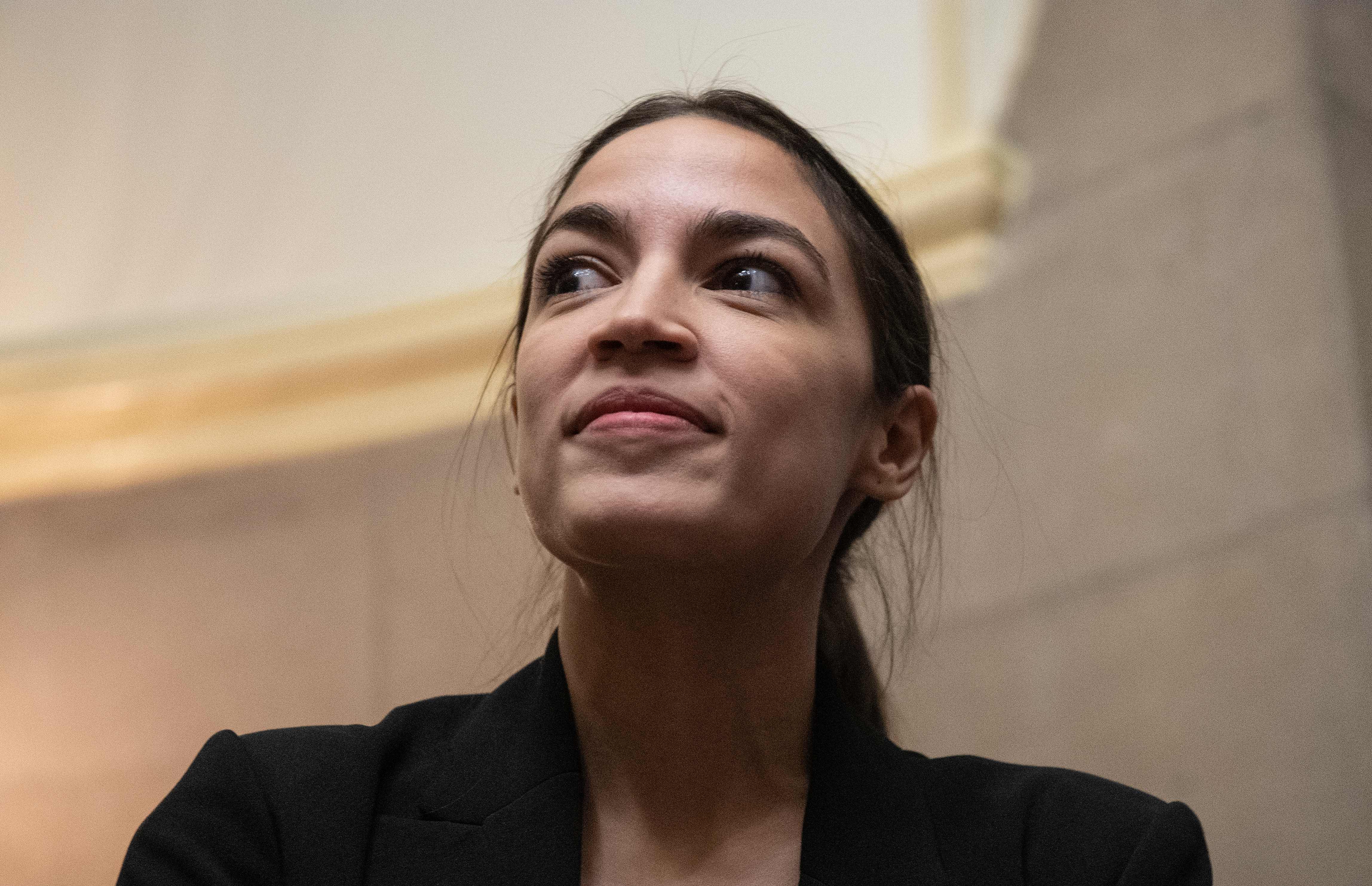 US Democratic Representative from New York Alexandria Ocasio Cortez looks on at the Capitol in Washington, DC, on January 16, 2019. (Photo by NICHOLAS KAMM / AFP) (Photo credit should read NICHOLAS KAMM/AFP/Getty Images)