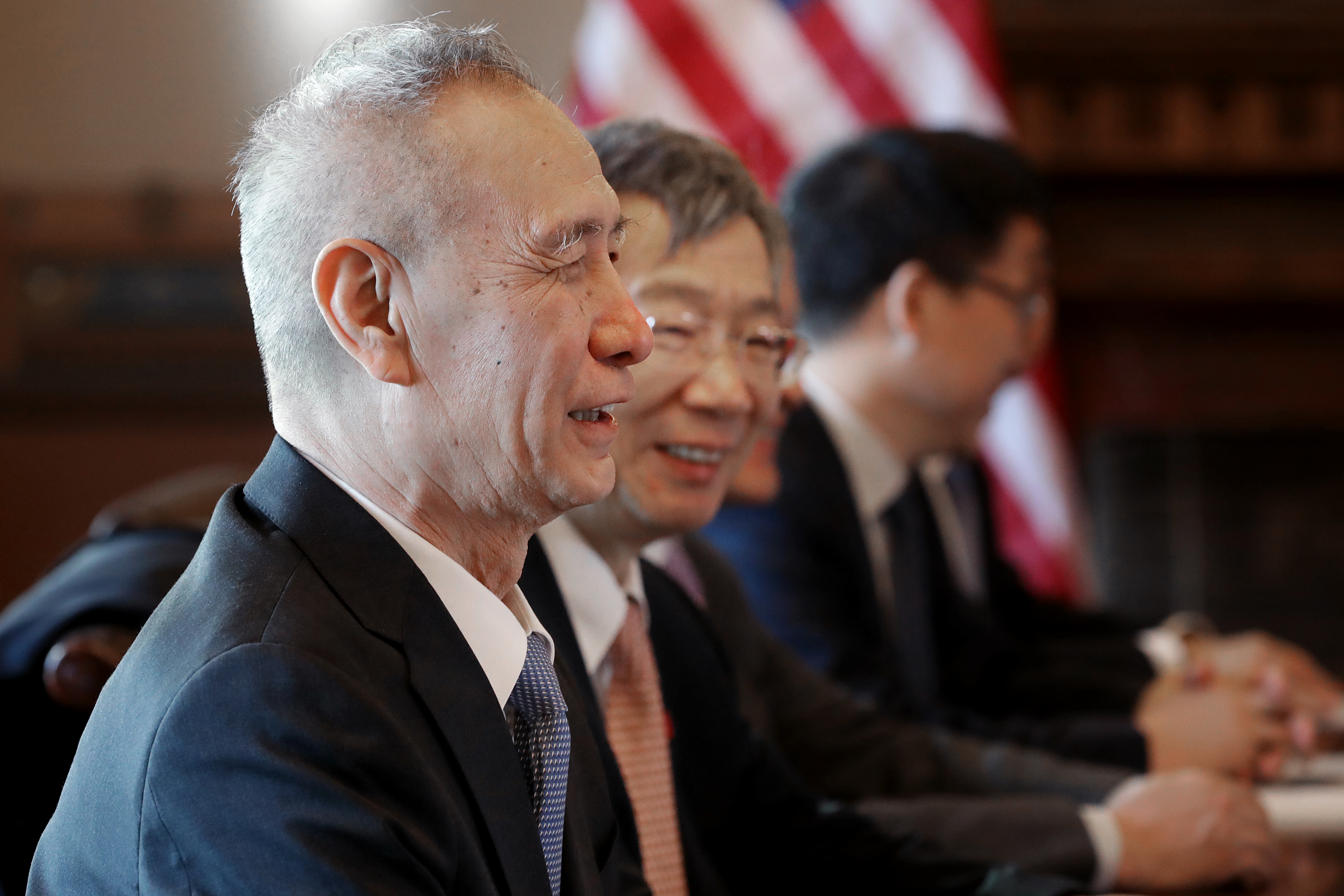 Chinese Vice Premier Liu He (L), Central Bank Governor Yi Gang (2nd L) and other Chinese vice ministers and senior officials sit down with Trump Administration officials for negotiations in the Diplomatic Room at the Eisenhower Executive Office Building January 30, 2019 in Washington, DC. (Photo by Chip Somodevilla/Getty Images)