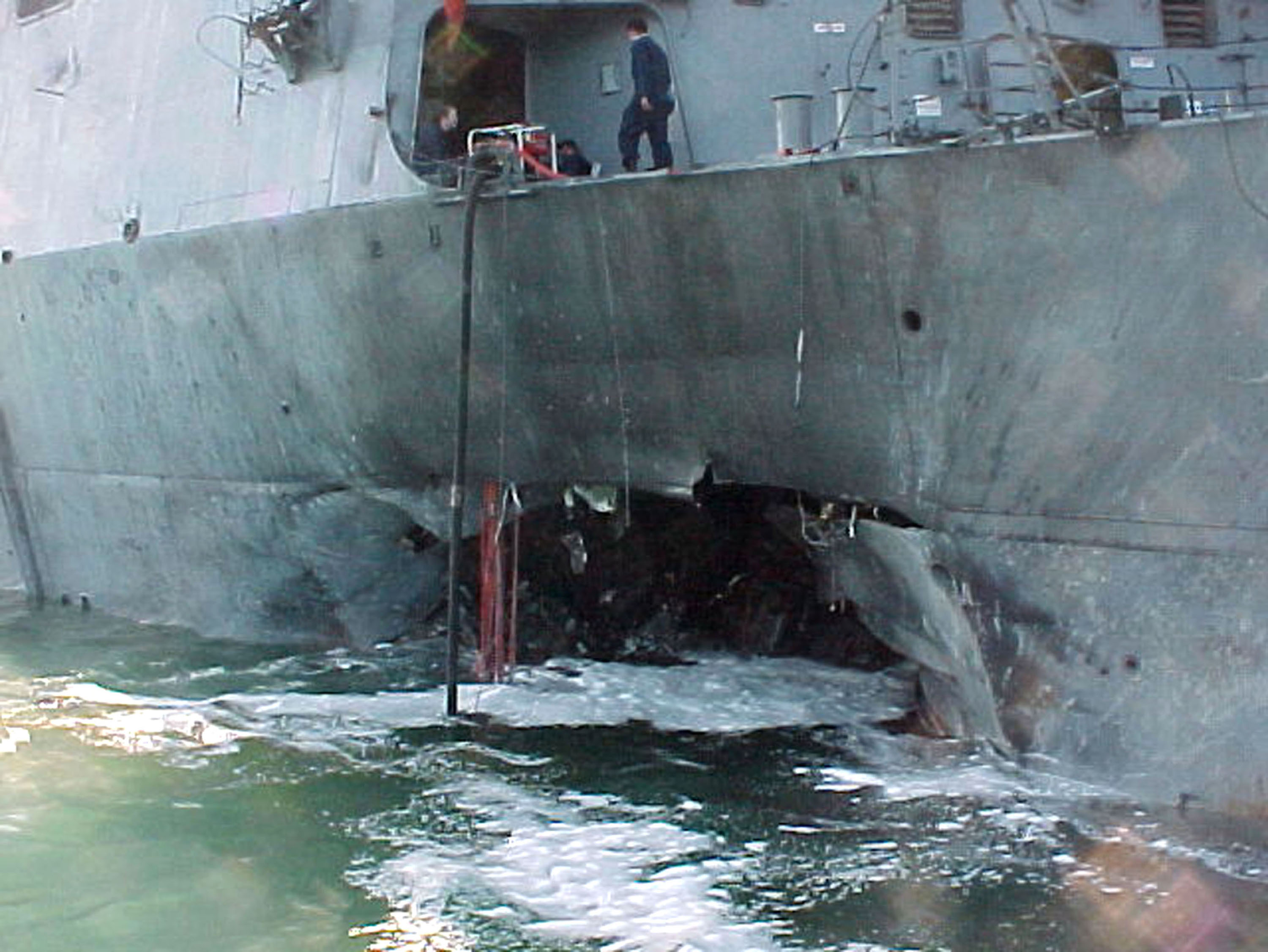 A gaping hole mars the port side of the Arleigh Burke class guided missile destroyer USS Cole after a terrorist bomb exploded and killed 17 U.S. sailors and injured approximately 36 others during a refueling operation October 12, 2000 in the port of Aden, Yemen. Al-Qaeda's chief of Persian Gulf operations, Abd al-Rahim al-Nashiri, also known as "Al Maqqi," has been captured, U.S. government officials said November 21, 2002. Al-Nashiri is believed to have been involved in planning numerous attacks, including the bombing of the USS Cole in Yemen, officials said. (Photo Courtesy of U.S. Navy/Getty Images)