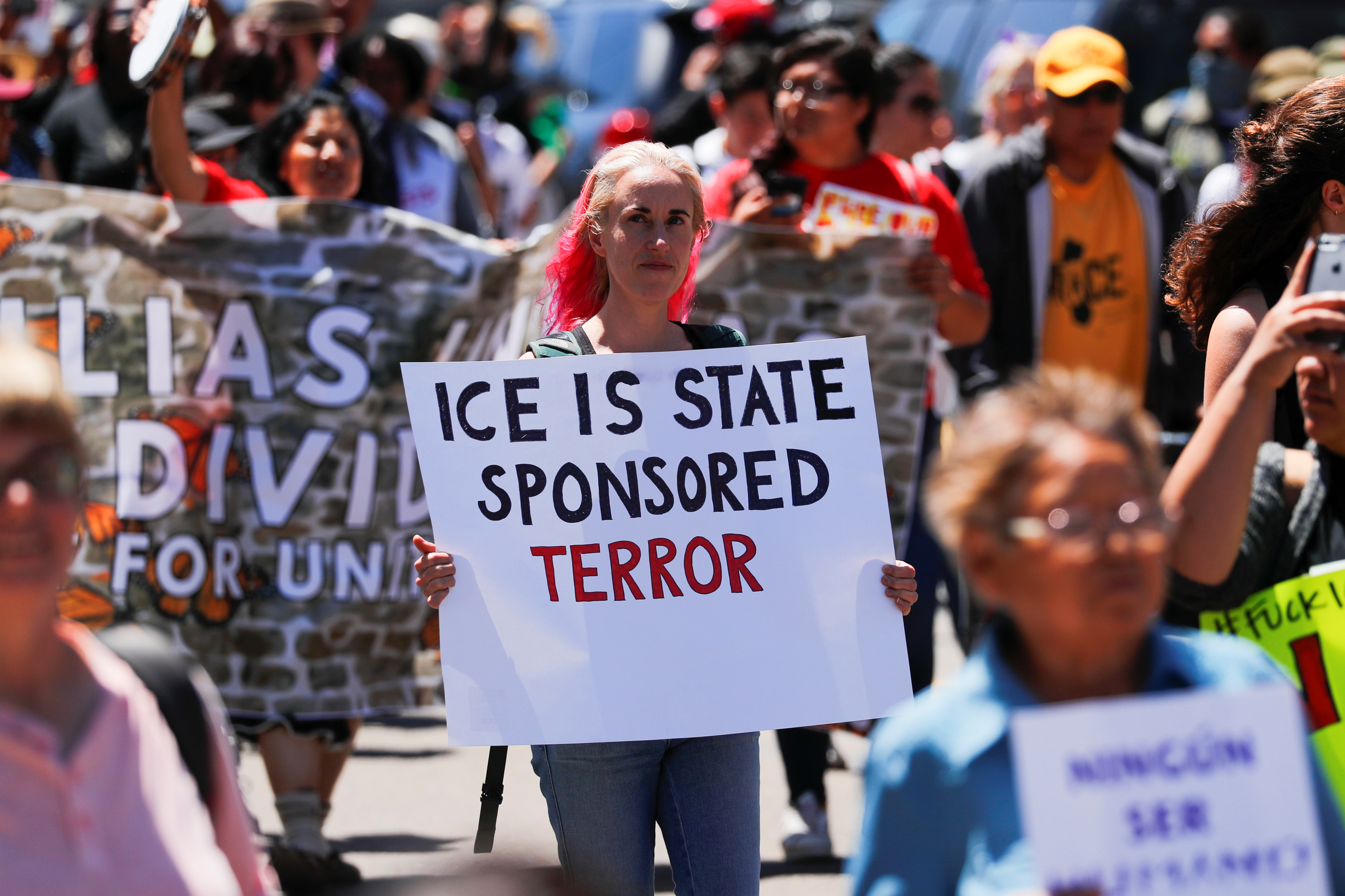 People march during a "Free Our Future" demonstration to protest the expected introduction of the U.S. Department of Justice and Immigration Customs Enforcement ( I.C.E.) new sped up mass immigration hearings and deportation in San Diego, California, U.S. July 2, 2018. REUTERS/Mike Blake