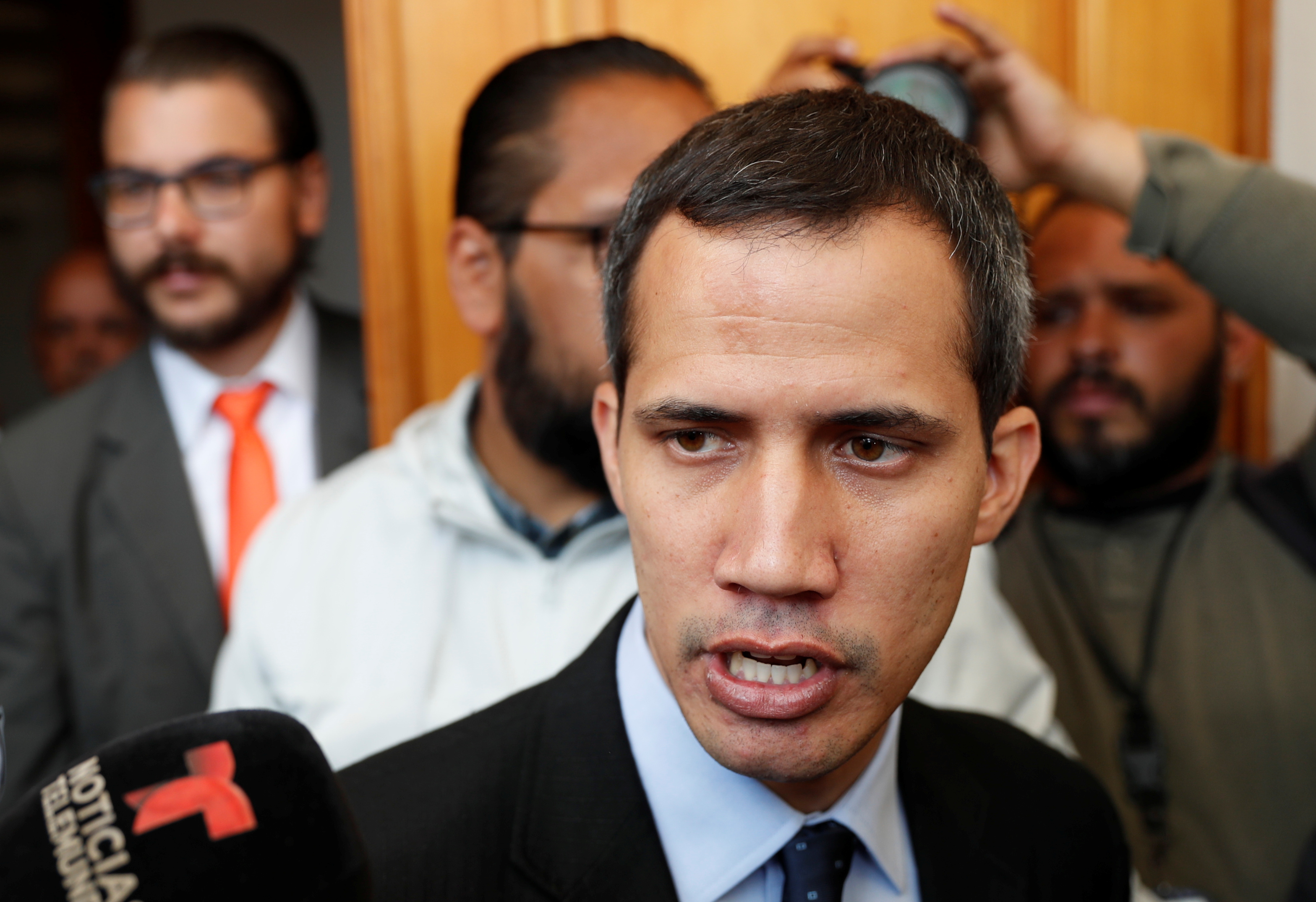 Venezuelan opposition leader and self-proclaimed interim president Juan Guaido talks to the media before a session of the Venezuela’s National Assembly in Caracas, Venezuela January 29, 2019. REUTERS/Carlos Garcia Rawlins