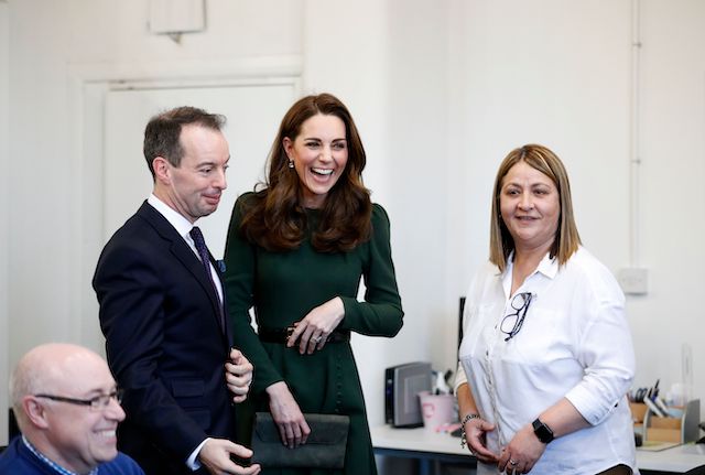 Britain's Catherine, Duchess of Cambridge reacts as she is introduced to staff members during a visit Family Action in Lewisham, south London on January 22, 2019, where she helped launch a new national support line. - Family Action works directly with vulnerable children and families through some 150 local and national services. Their new service 'FamilyLine' will use a network of volunteers to support parents and carers virtually through telephone calls, email and text messaging. (Photo credit: ADRIAN DENNIS/AFP/Getty Images)