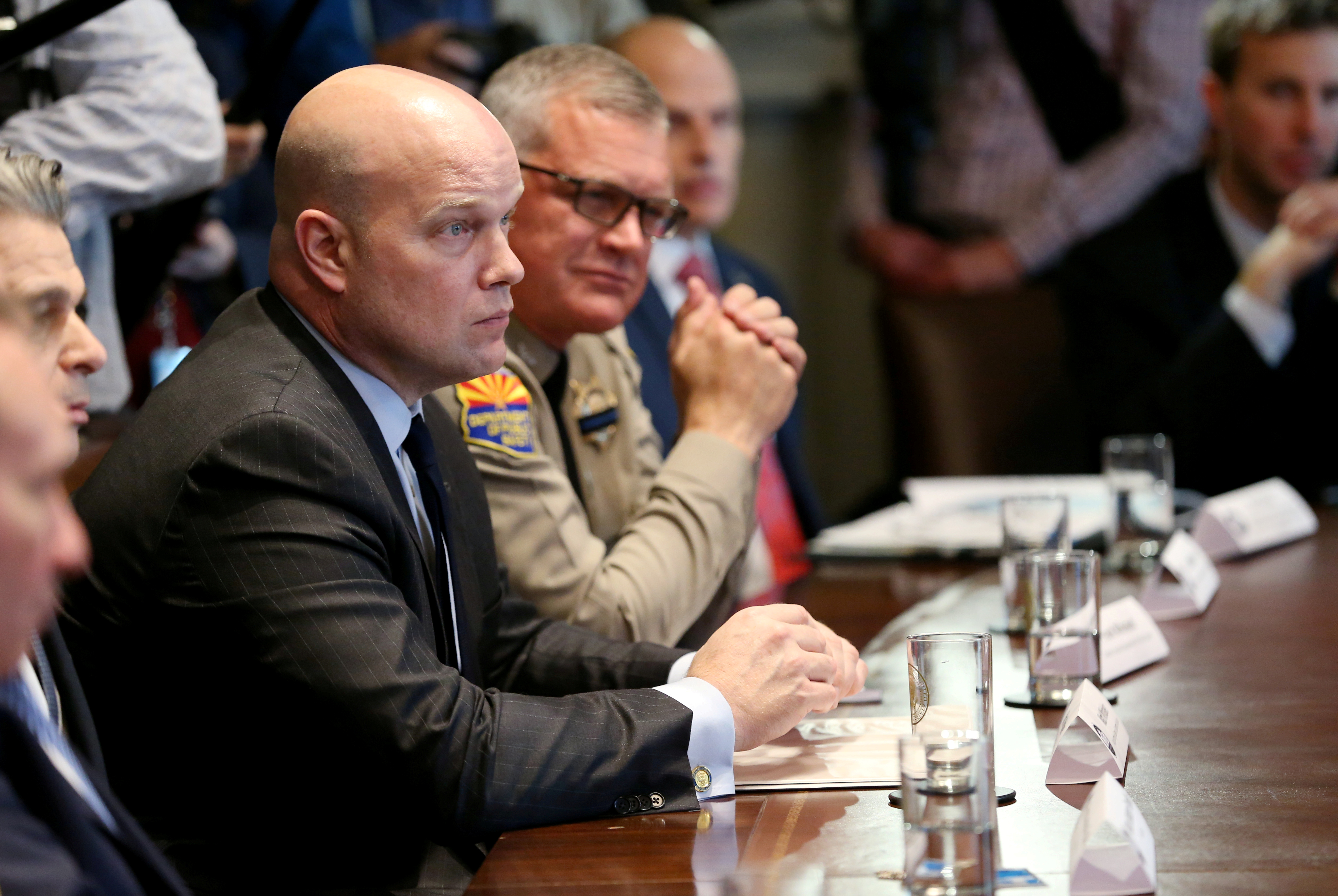 Acting Attorney General Matthew Whitaker listens as President Donald Trump holds a meeting about border security with state, local and community leaders at the White House. REUTERS/Leah Millis