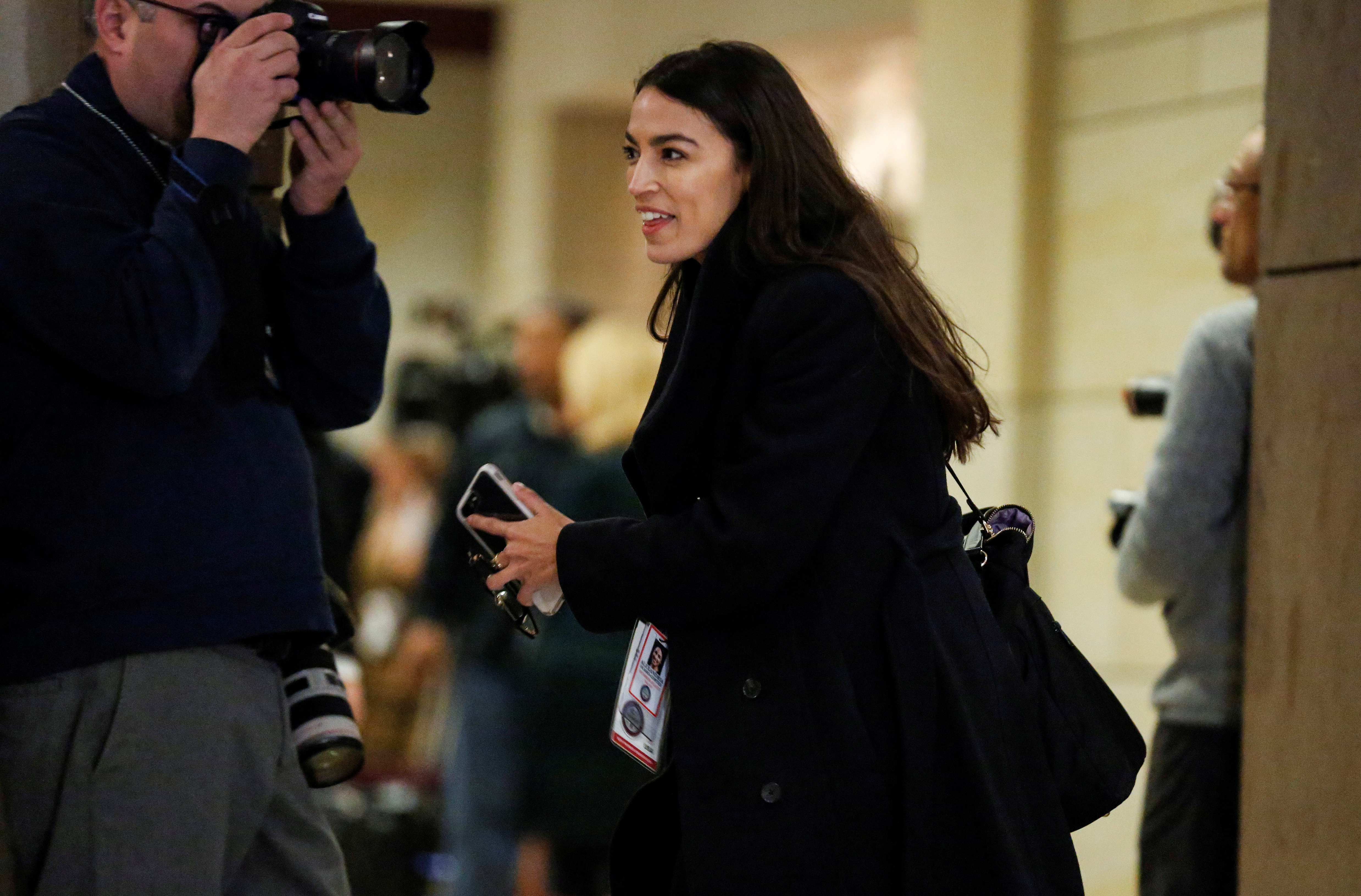 Representative-elect Alexandria Ocasio-Cortez (D-NY) arrives for a House Democratic Caucus meeting to choose leaders for the 116th Congress on Capitol Hill in Washington