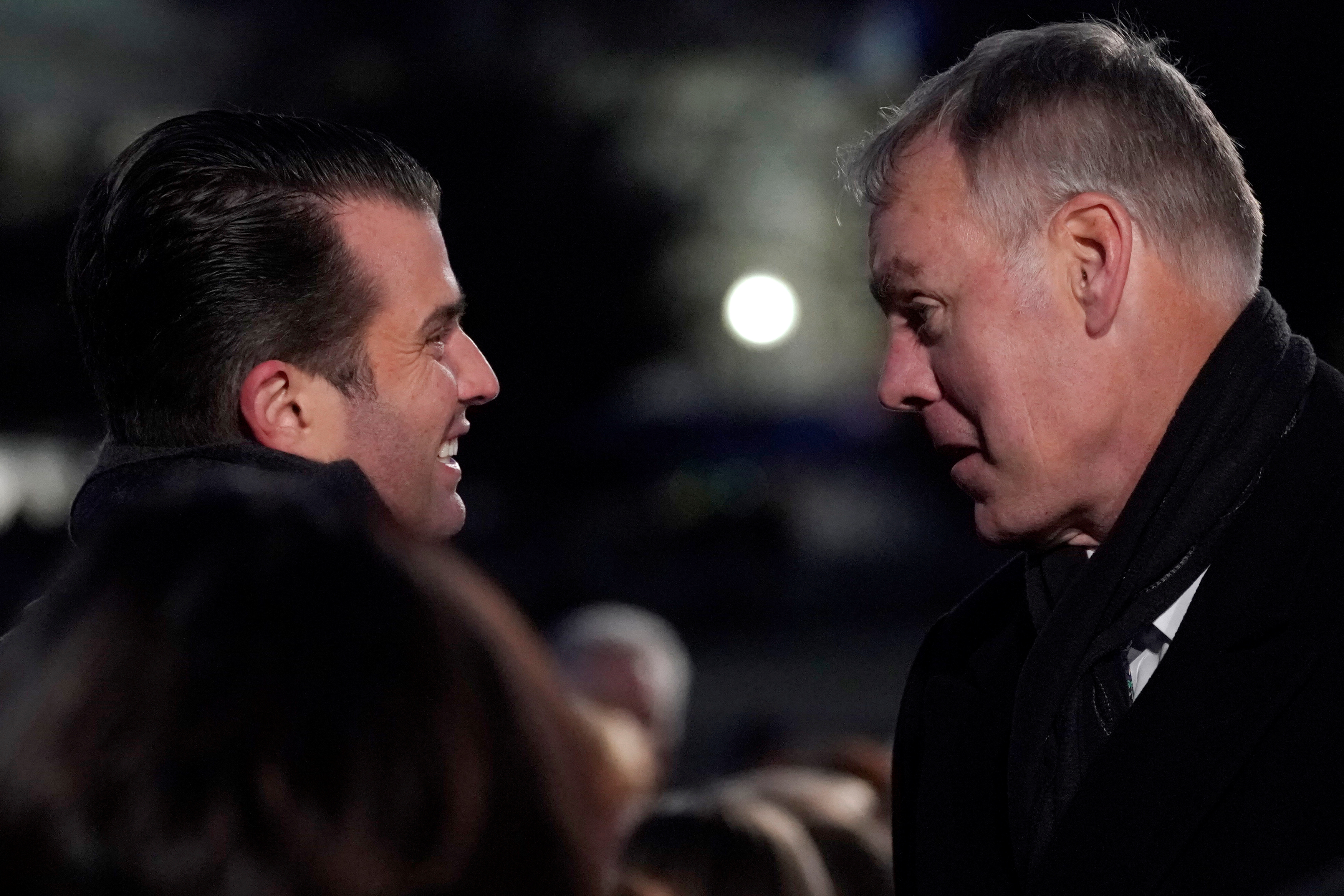 Trump Jr. speaks with U.S. Interior Secretary Zinke as they arrive for the 96th annual National Christmas Tree Lighting ceremony near the White House in Washington
