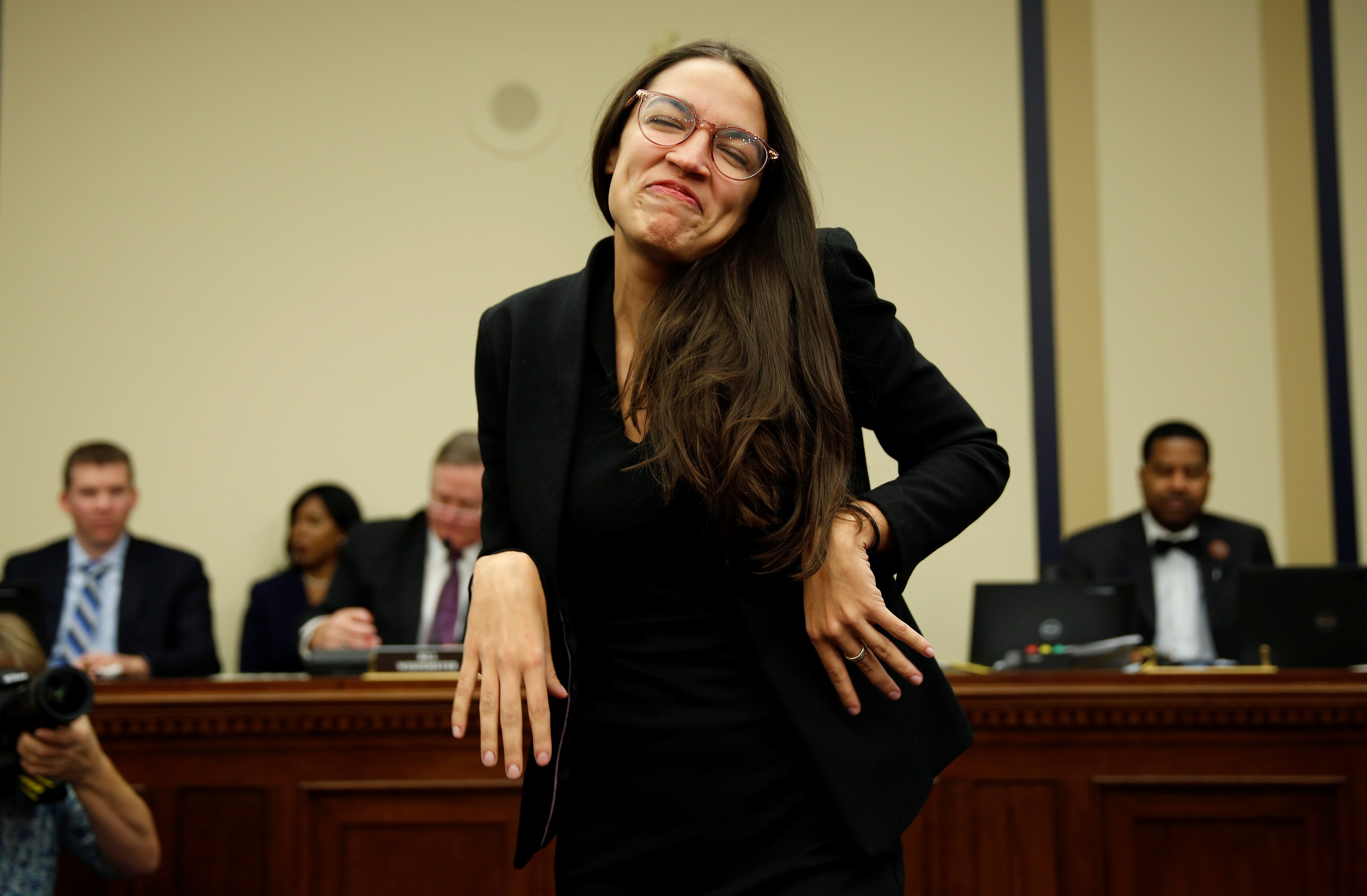 Representative-elect Alexandria Ocasio Cortez (D-NY) reacts to drawing number 40 during a lottery for office assignments on Capitol Hill in Washington