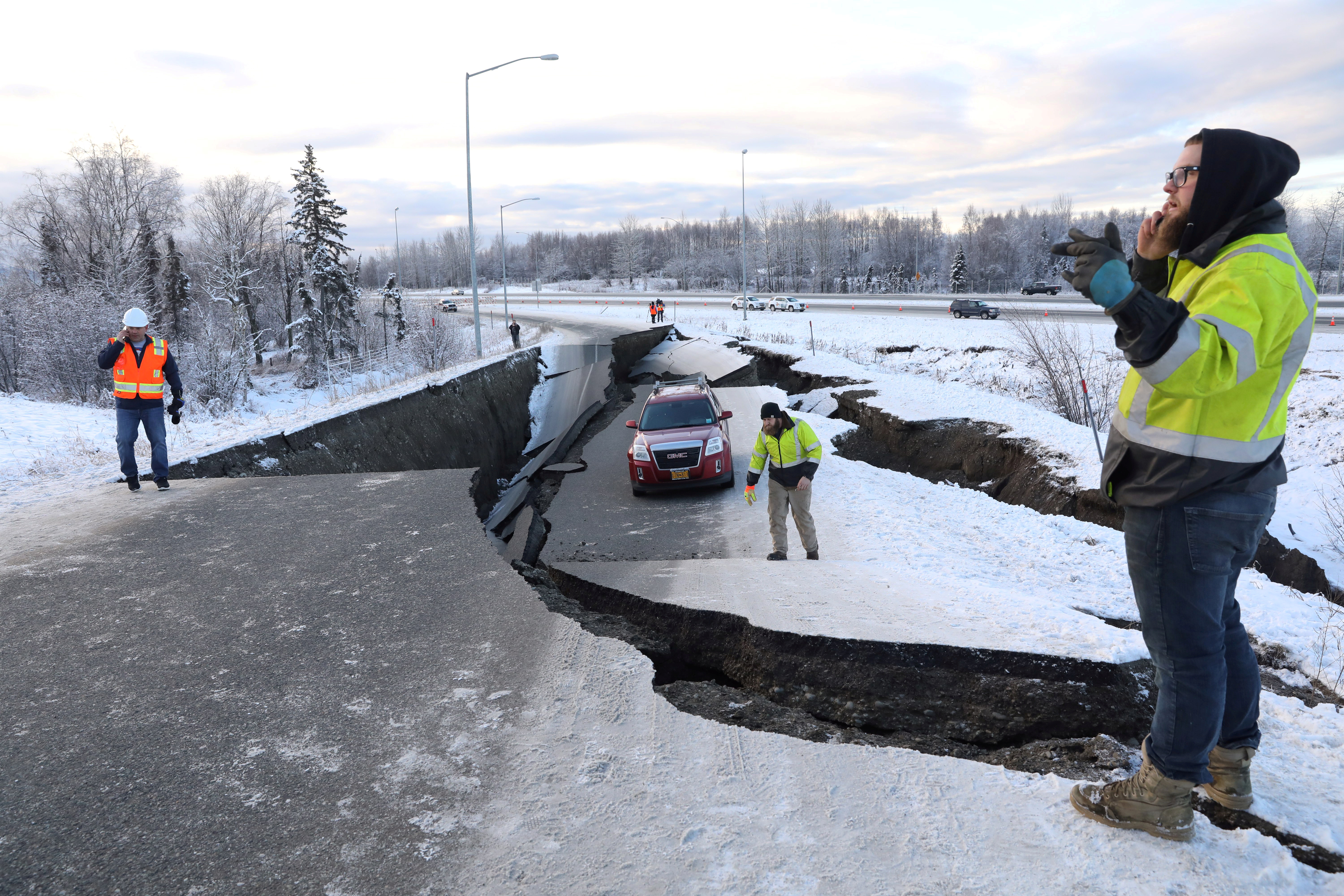 A stranded vehicle lies on a collapsed roadway near the airport after an earthquake in Anchorage, Alaska, U.S. November 30, 2018. REUTERS/Nathaniel Wilder