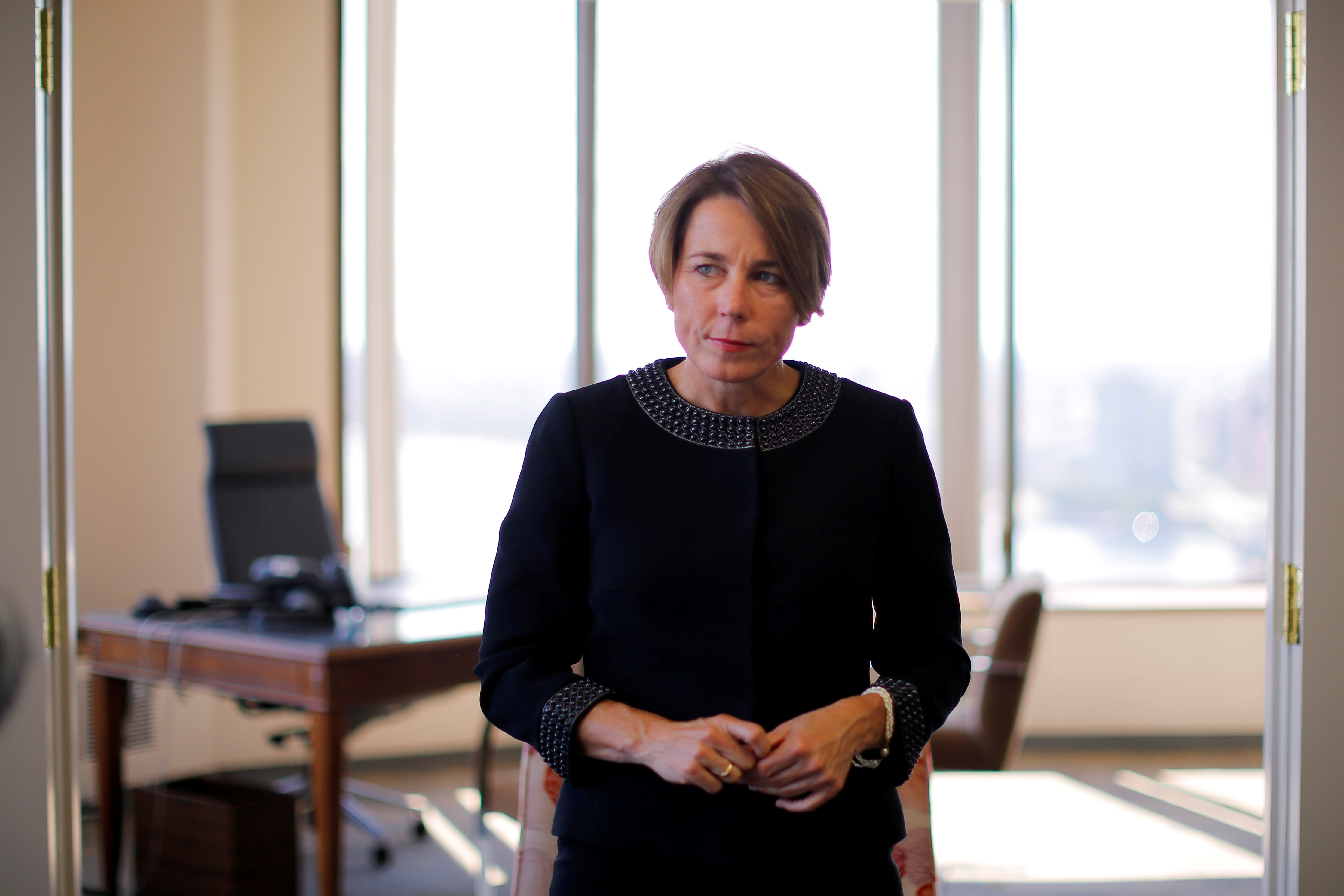 Massachusetts Attorney General Maura Healey listens to a question during an interview with Reuters at her office in Boston