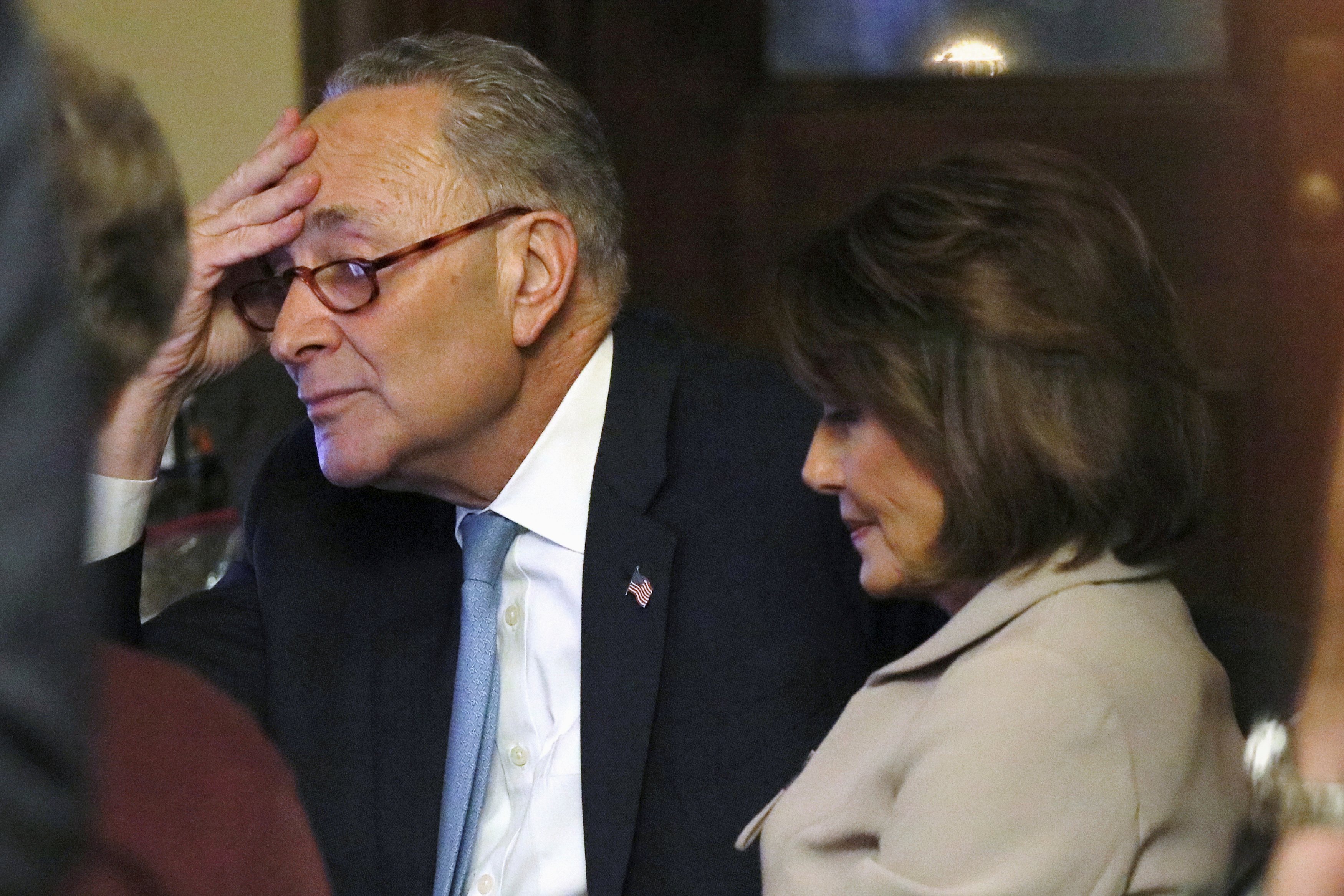 U.S. Senate Minority Leader Chuck Schumer and Speaker of the House Nancy Pelosi are seen shortly after concluding their joint response, to President Trump's prime time address, on Capitol Hill in Washington, U.S., January 8, 2019. REUTERS/Jonathan Ernst TPX IMAGES OF THE DAY - RC1CC2C80350