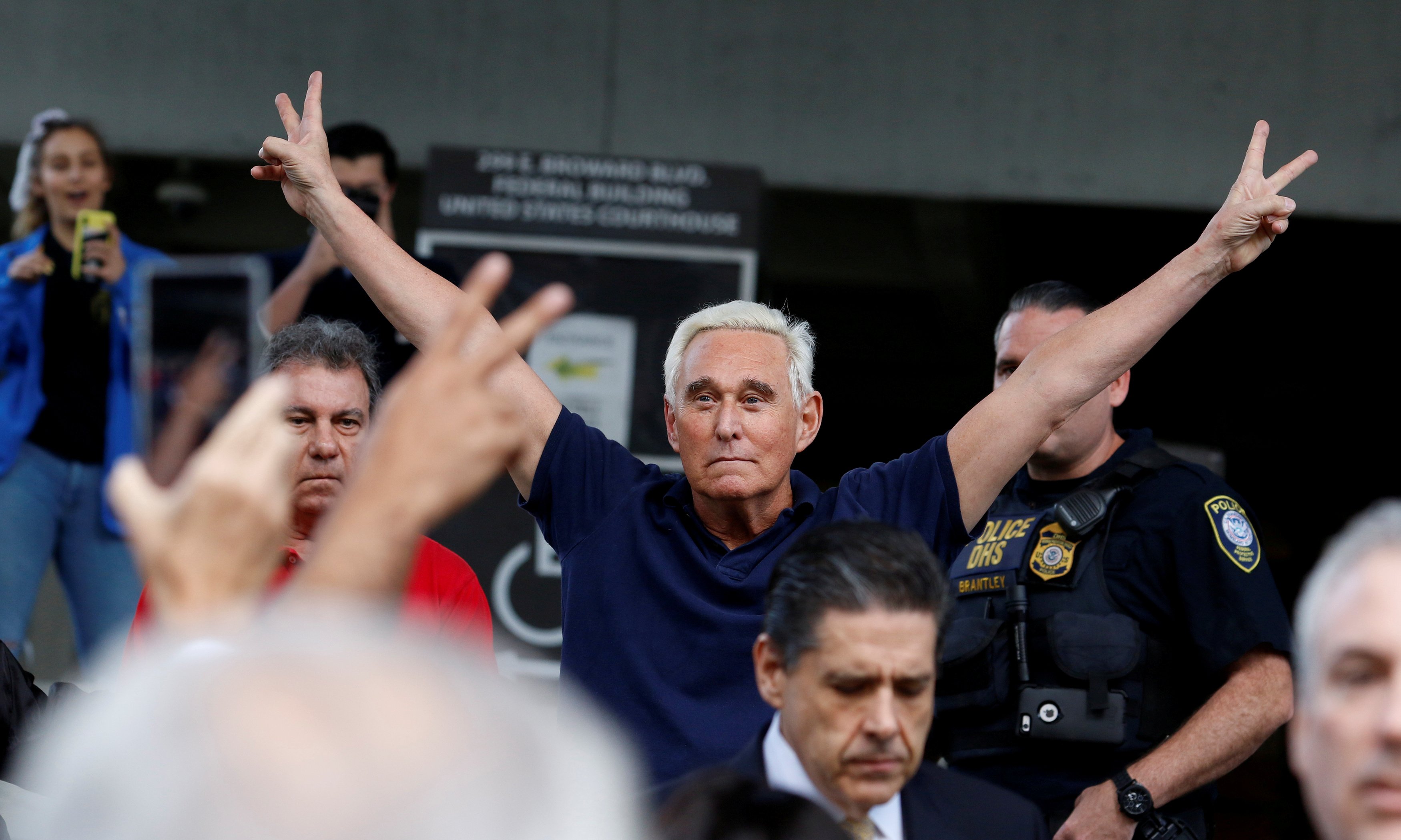 Roger Stone reacts as he walks to microphones after his appearance at Federal Court in Fort Lauderdale, Florida, U.S., January 25, 2019. REUTERS/Joe Skipper 