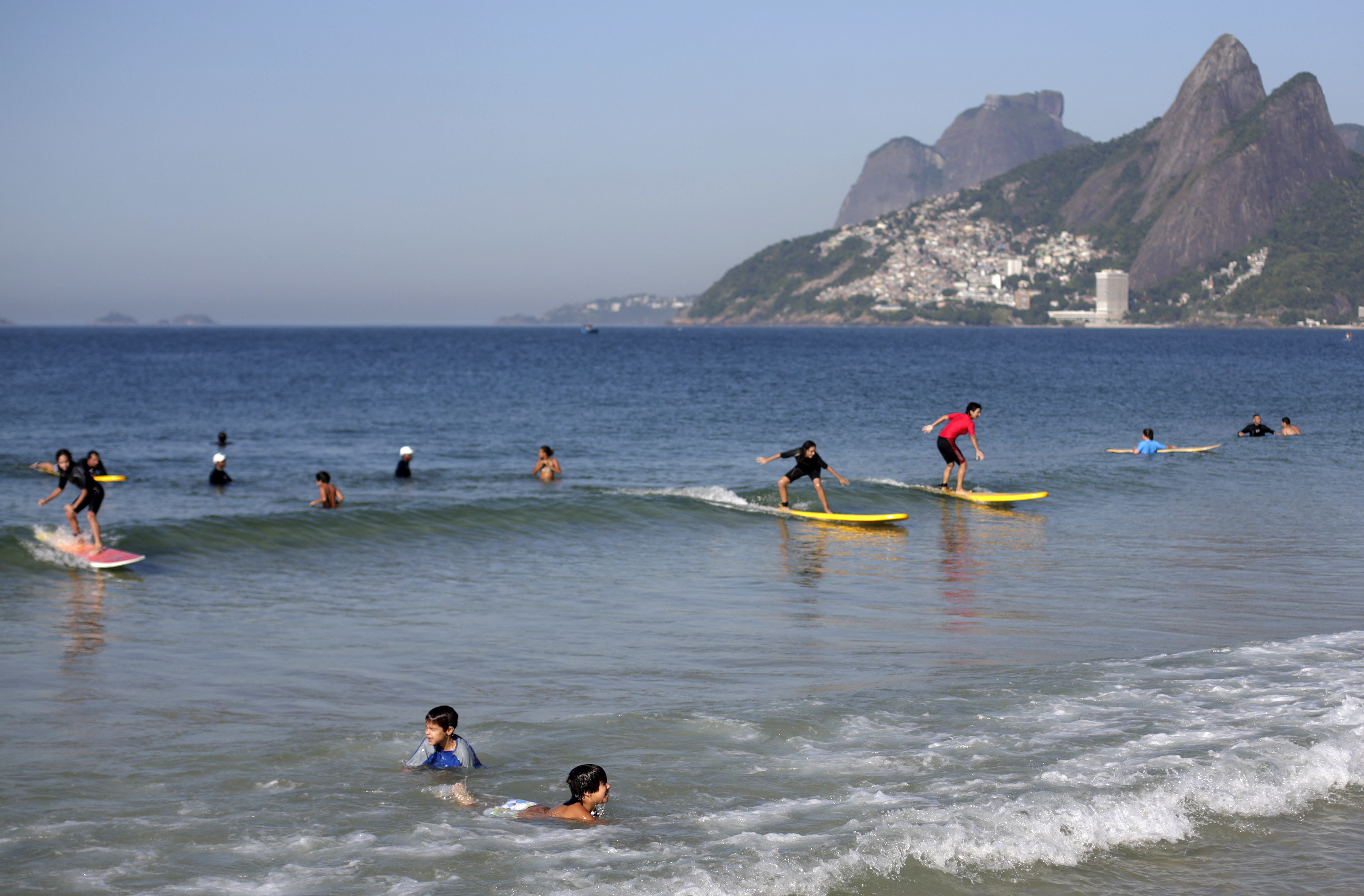 Children play on Arpoador beach in Rio de Janeiro