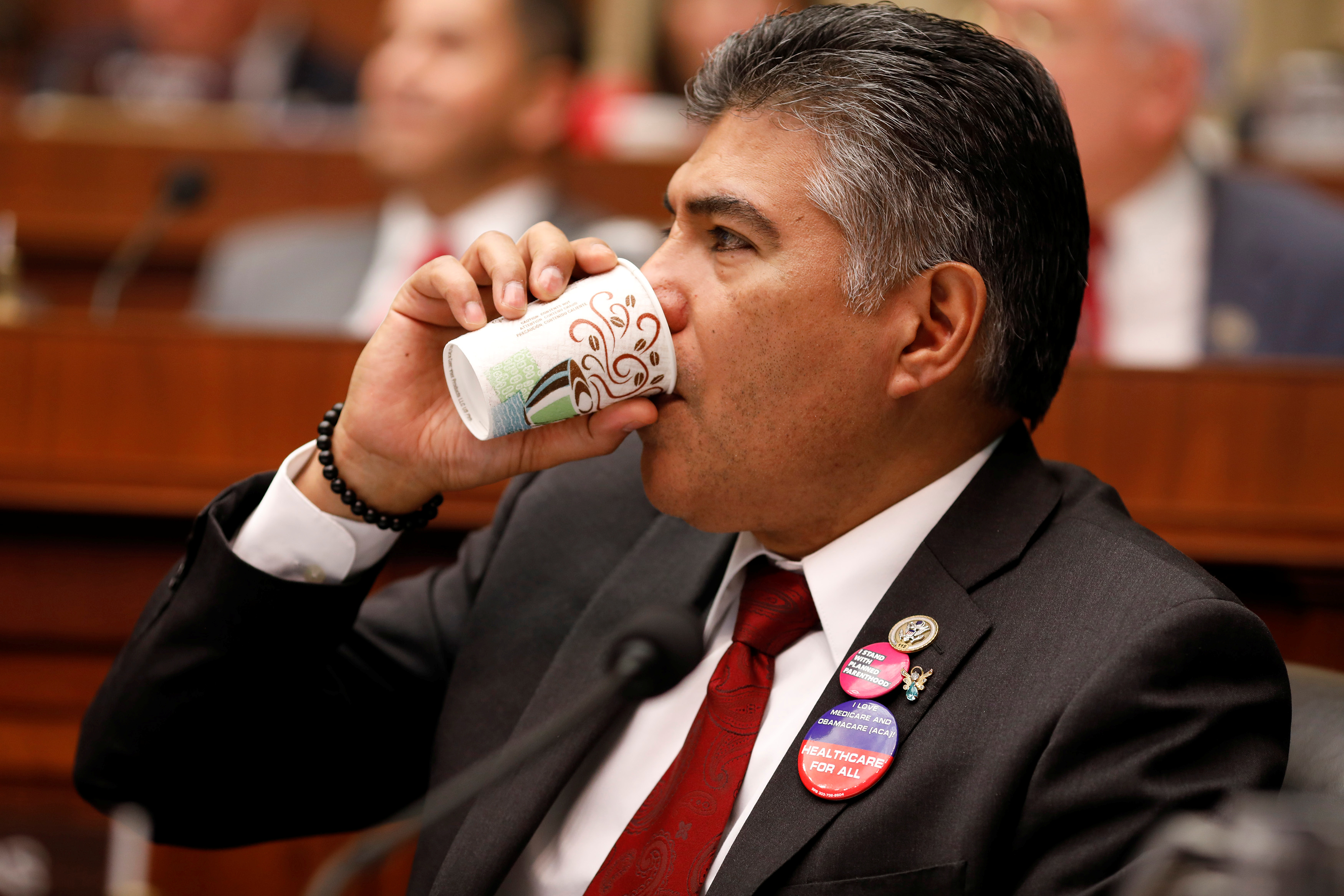 Rep. Tony Cardenas (D-CA) drinks coffee during a marathon House Energy and Commerce Committee hearing on a potential replacement for the Affordable Care Act