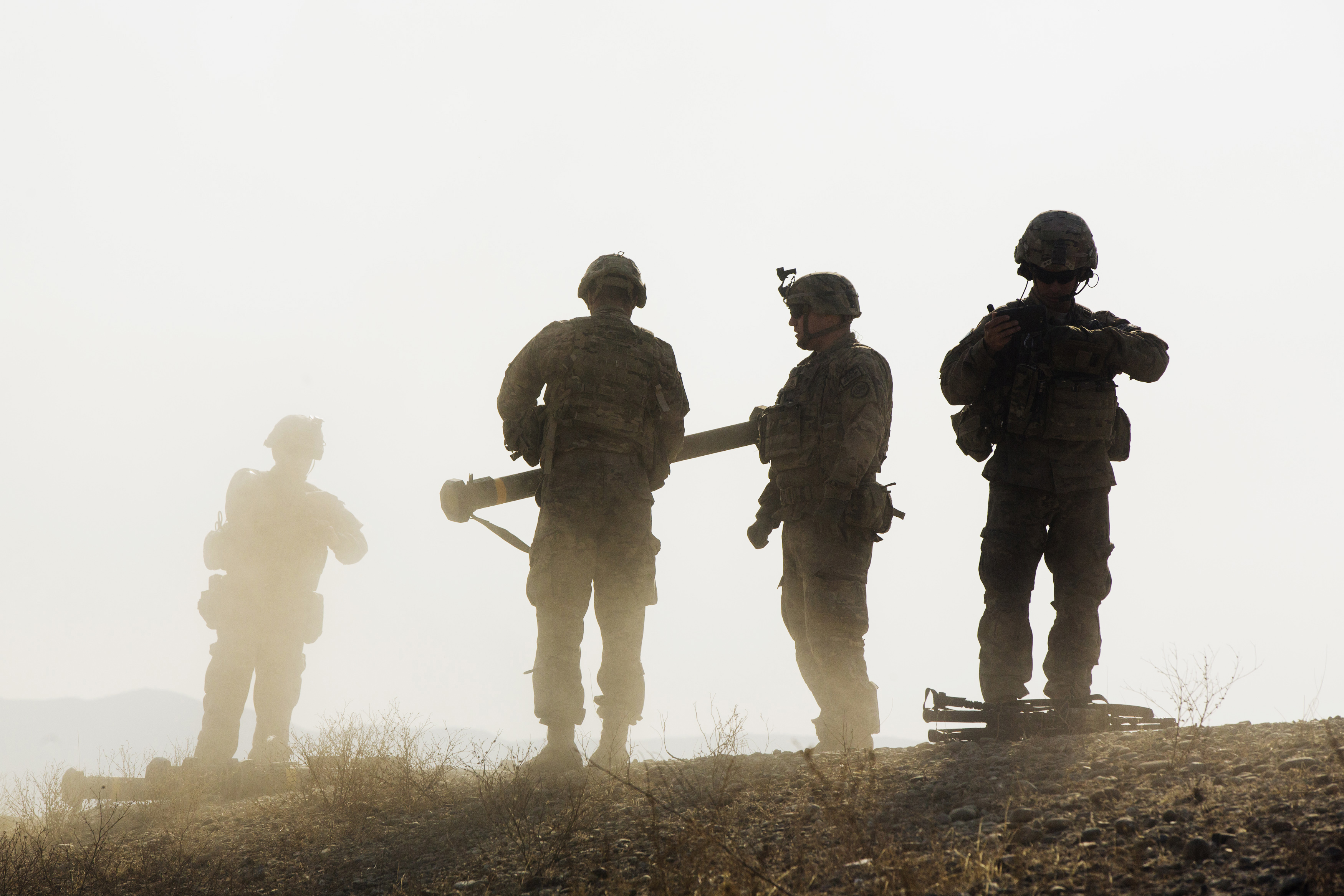 U.S. soldiers from D Troop of the 3rd Cavalry Regiment walk on a hill after finishing with a training exercise near forward operating base Gamberi in the Laghman province of Afghanistan December 30, 2014. REUTERS/Lucas Jackson 