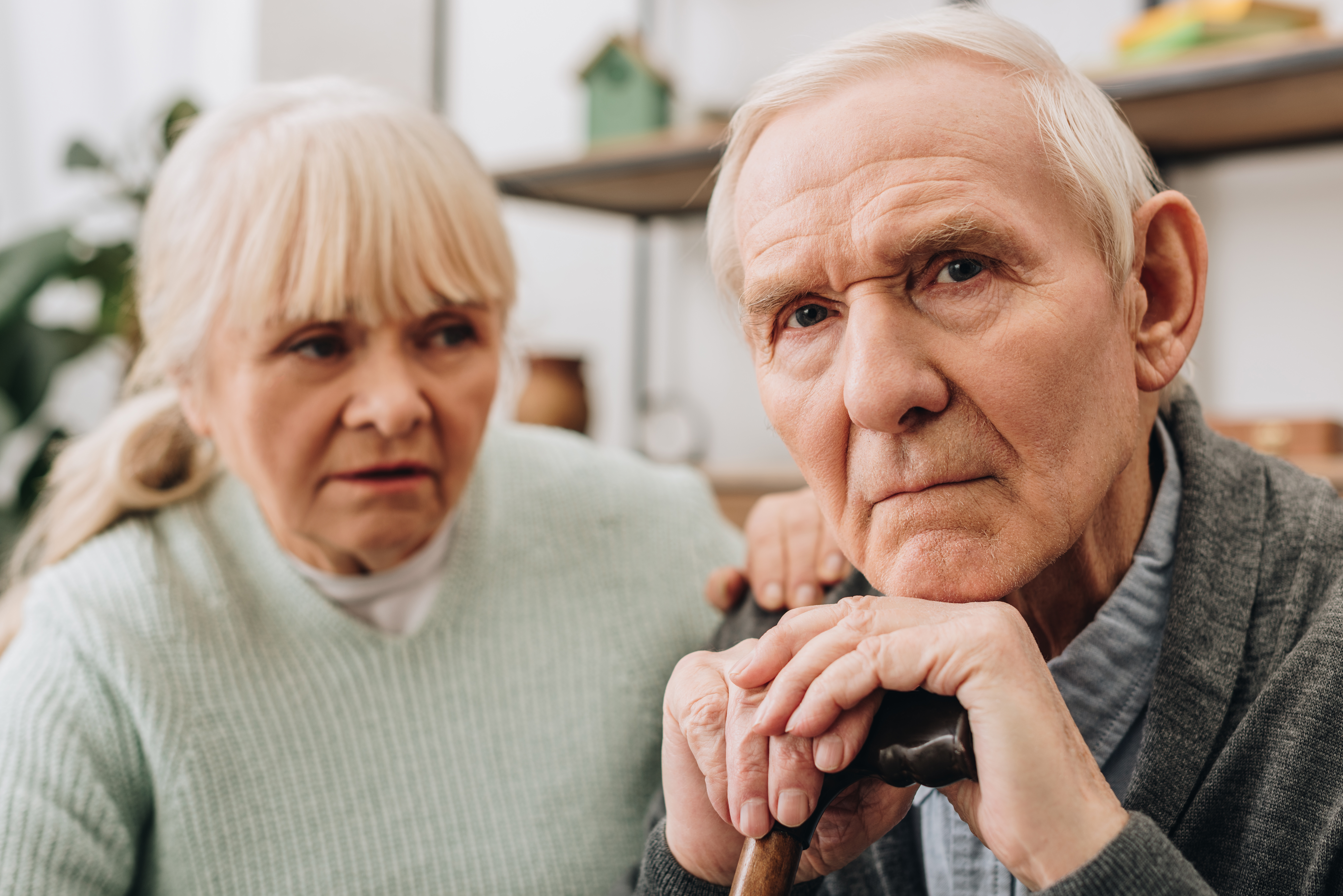 An older couple look thoughtful. Shutterstock image via user LightField Studio