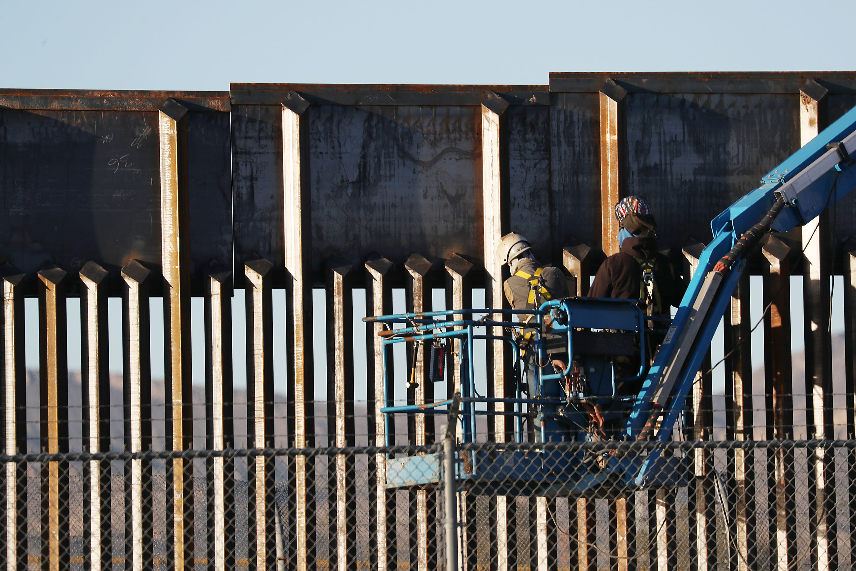 People work on the U.S./ Mexican border wall on February 12, 2019 in El Paso, Texas. (Joe Raedle/Getty Images)