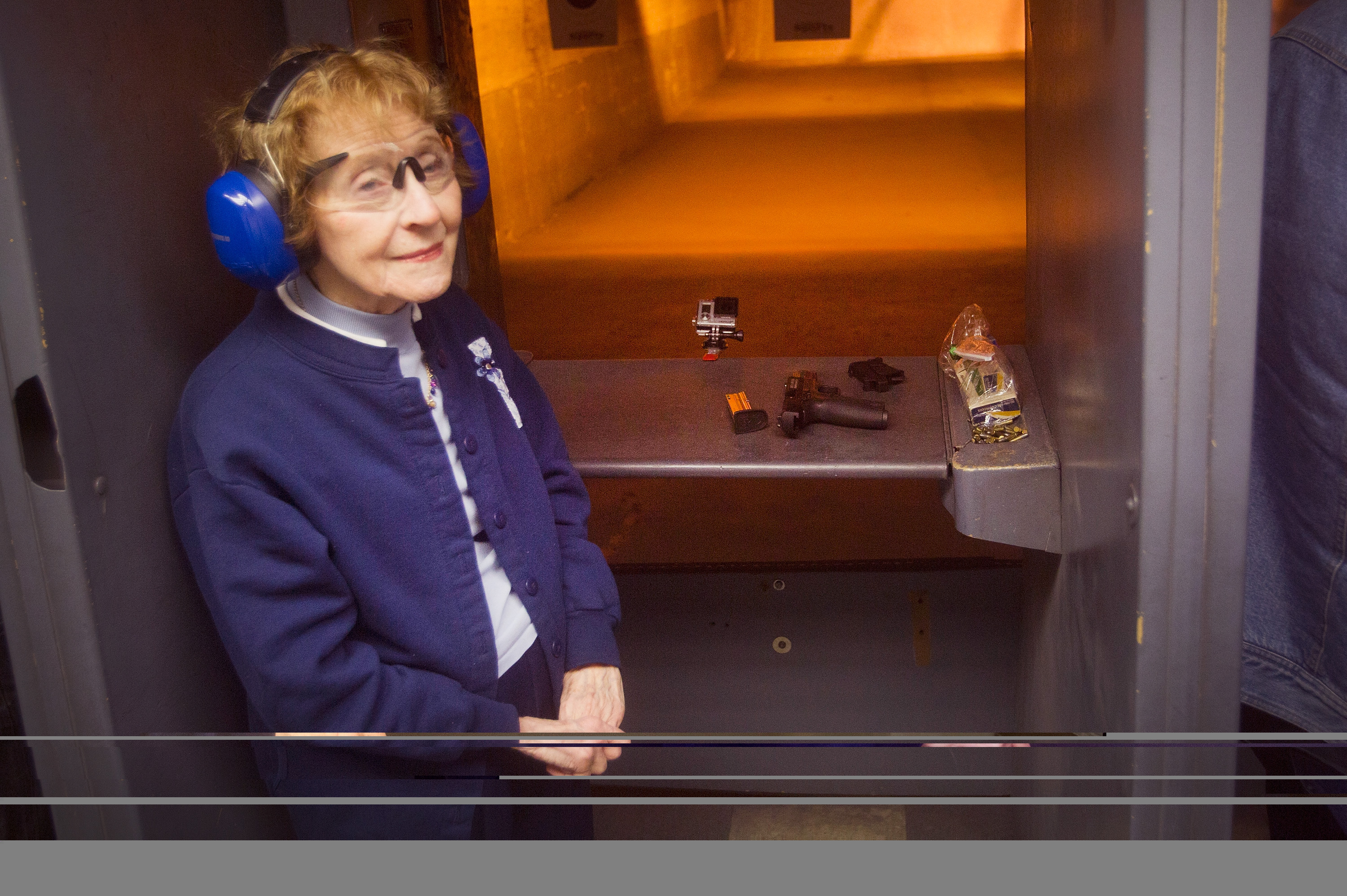 Eighty-three-year-old Evelyn Donohue listens to instructions at a shooting range before firing her pistol to qualify for an Illinois concealed carry permit on February 14, 2014 in Posen, Illinois. Illinois recently became the final state to allow residents to carry a concealed weapon after they complete a 16-hour course. (Photo by Scott Olson/Getty Images)