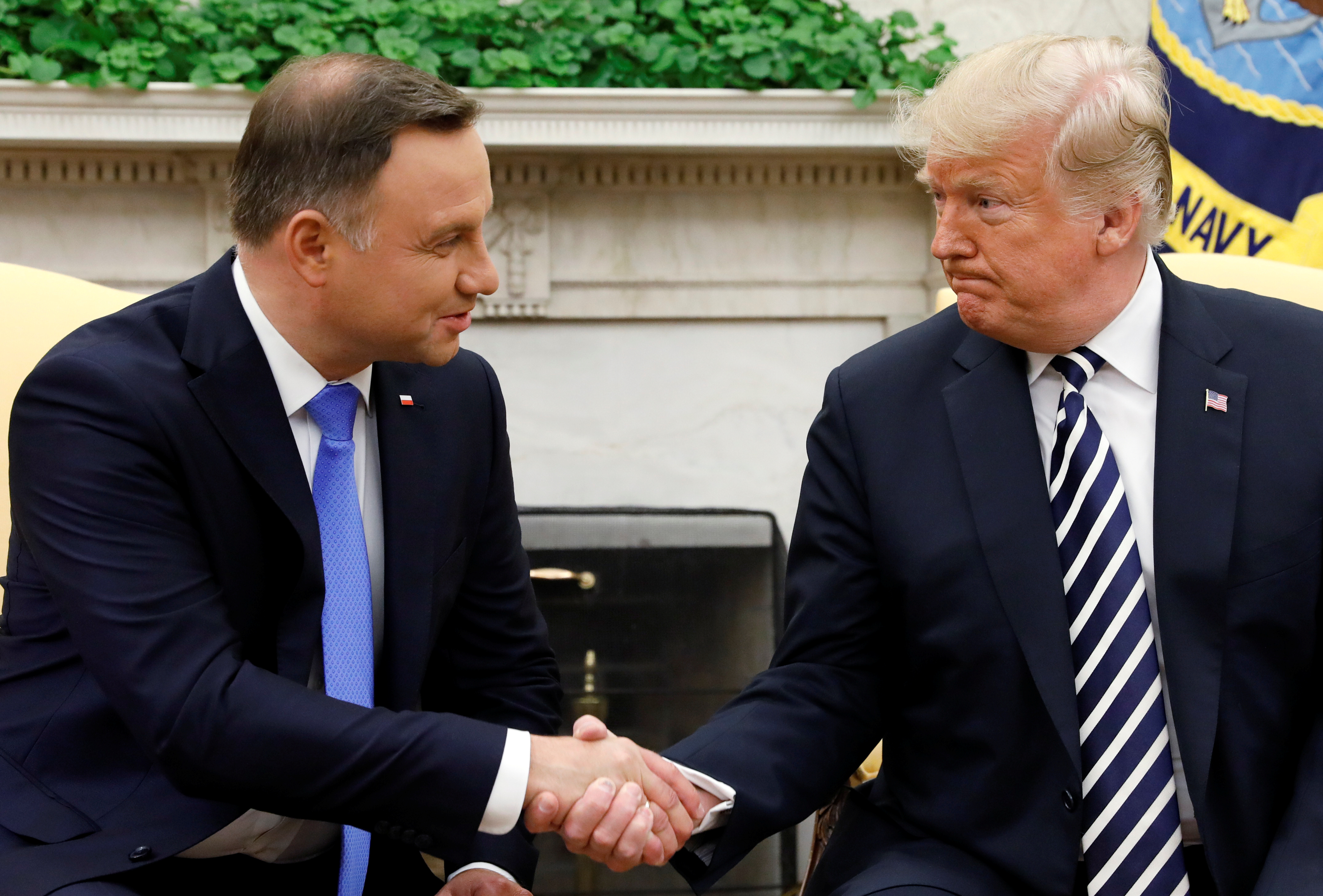 U.S. President Donald Trump greets Poland's President Andrzej Duda in the Oval Office of the White House in Washington, U.S., September 18, 2018. REUTERS/Kevin Lamarque