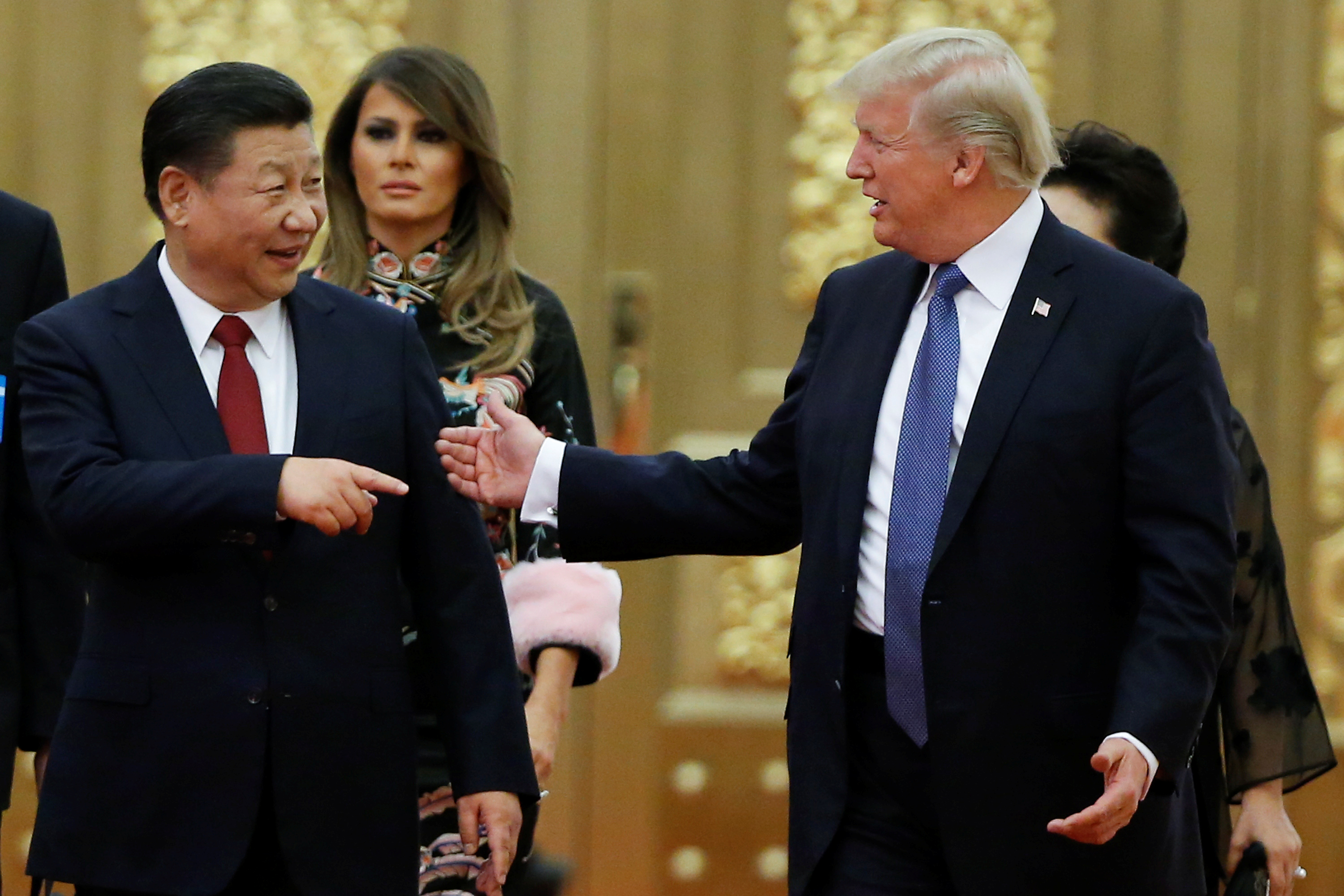 U.S. President Donald Trump and China's President Xi Jinping arrive at a state dinner at the Great Hall of the People in Beijing, China, November 9, 2017. REUTERS/Thomas Peter