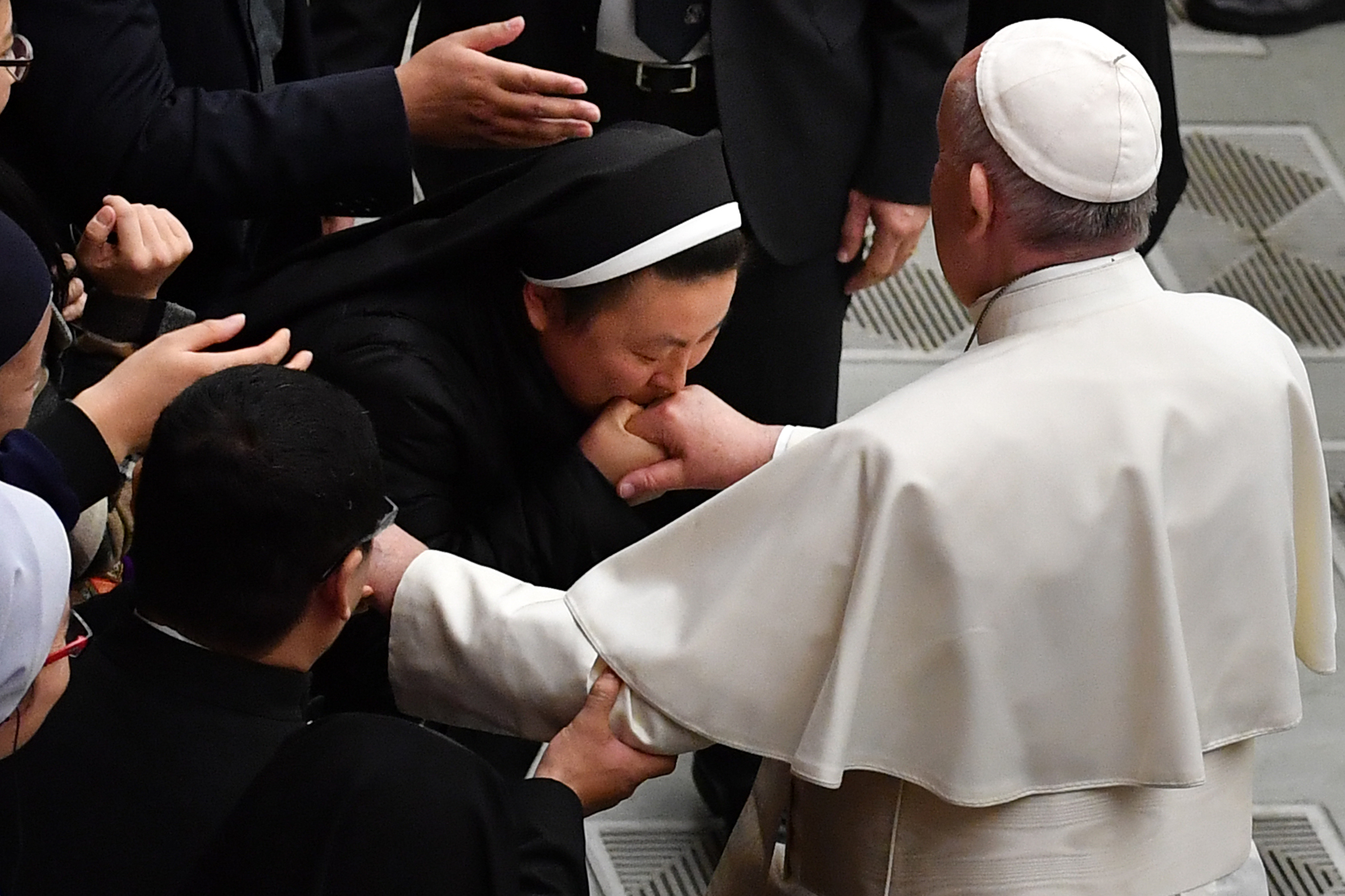 An Asian nun kisses Pope Francis' hand during the weekly general audience on February 6, 2019 at Paul-VI hall in the Vatican. (ANDREAS SOLARO/AFP/Getty Images)