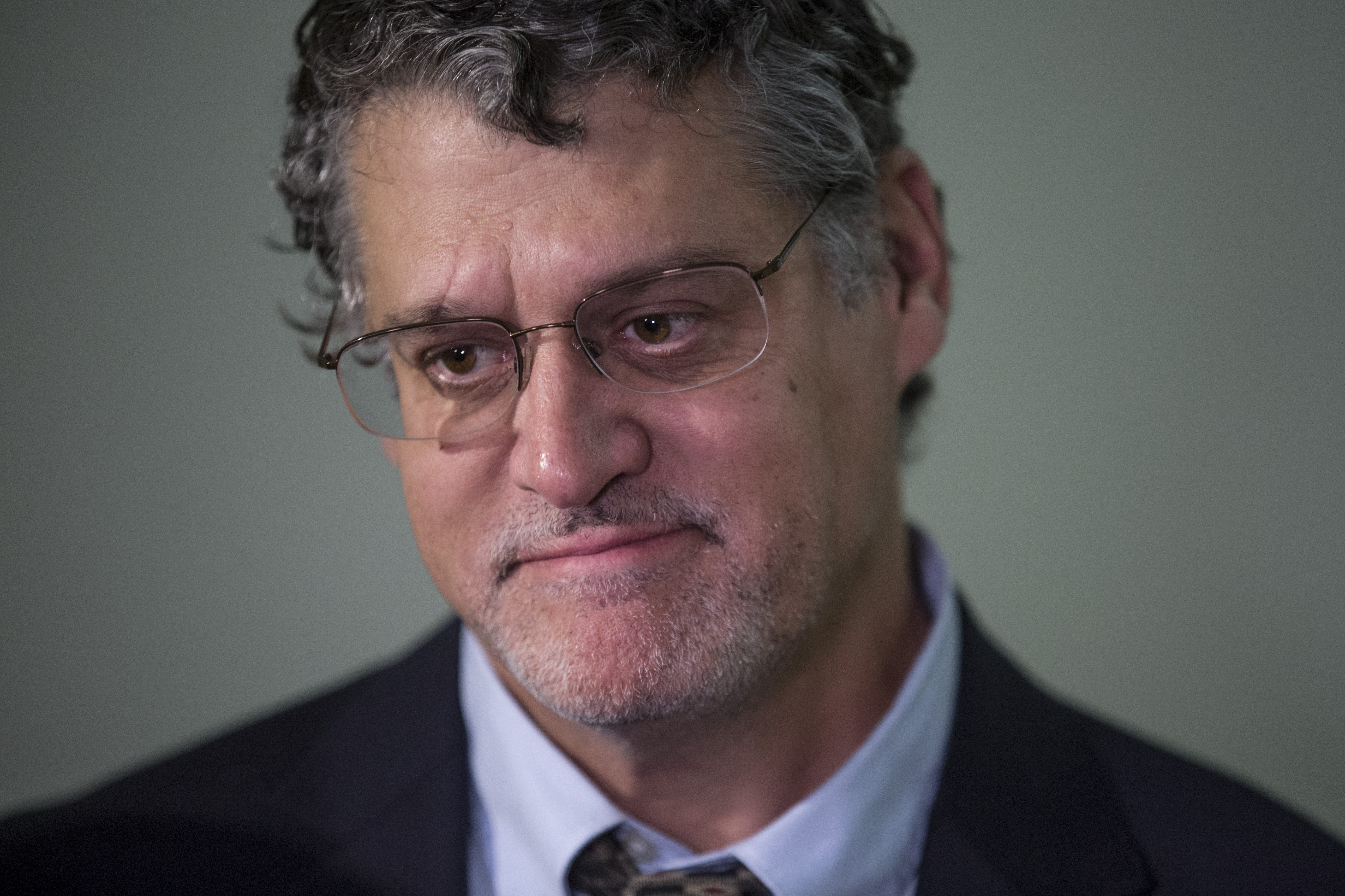 Fusion GPS Co-Founder Glenn Simpson listens as his lawyer, Joshua Levy, speaks to members of the media following a meeting with members of the House Judiciary and Oversight Committee in the Rayburn Office Building on Capitol Hill on October 16, 2018 in Washington, D.C. (Photo by Zach Gibson/Getty Images)