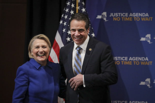 NEW YORK, NY - JANUARY 7: (L-R) Former Secretary of State Hillary Clinton and New York Governor Andrew Cuomo smile at the end of an event to discuss reproductive rights at Barnard College, January 7, 2019 in New York City. The two Democrats shared the stage to promote the Reproductive Health Act in New York, which Cuomo wants the State Legislature to pass in their first 30 days. Under New York's current law, abortions after 24 weeks are illegal unless its necessary to save the woman's life. (Photo by Drew Angerer/Getty Images)