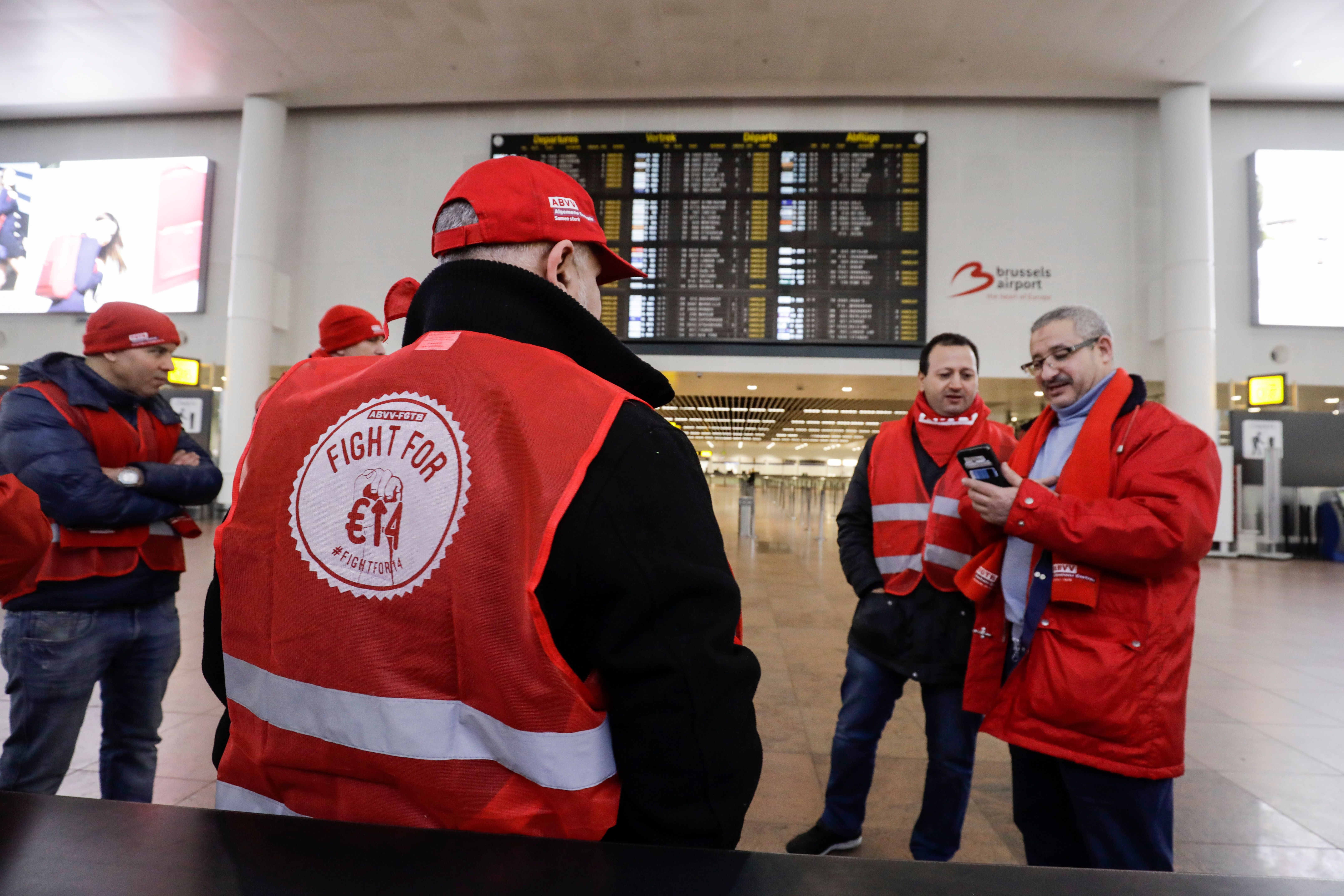 Union members stand at Brussels national airport in Zaventem, on the outskirts of the Belgium capital, on February 13, 2019, during a national general strike. (THIERRY ROGE / BELGA / AFP) / Belgium OUT (Photo credit should read THIERRY ROGE/AFP/Getty Images)