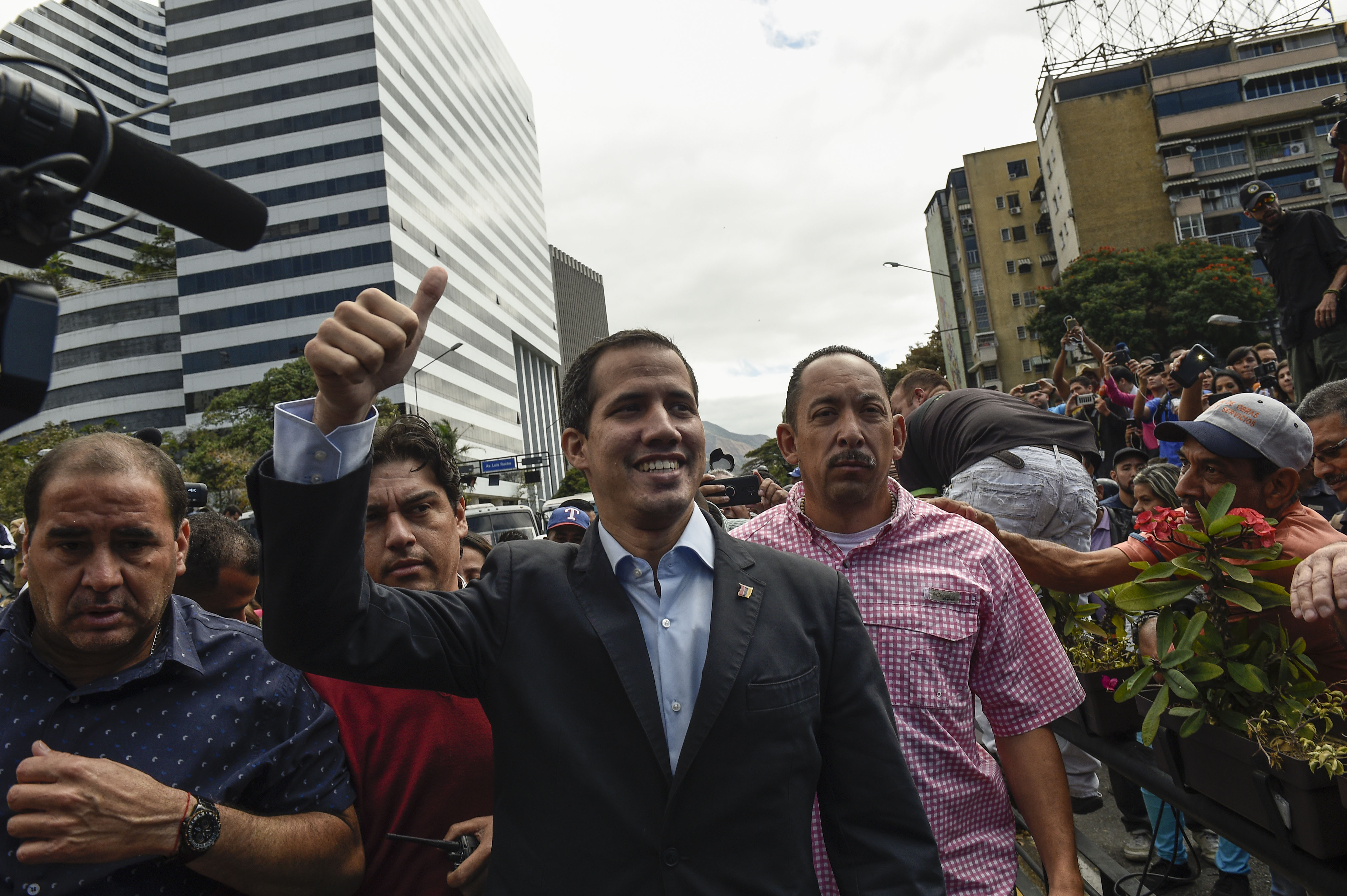 Venezuelan opposition leader and self declared acting president Juan Guaido (C), arrives to take part in a demonstration called by the transportation sector to support him, in Caracas on February 20, 2019. (FEDERICO PARRA/AFP/Getty Images)