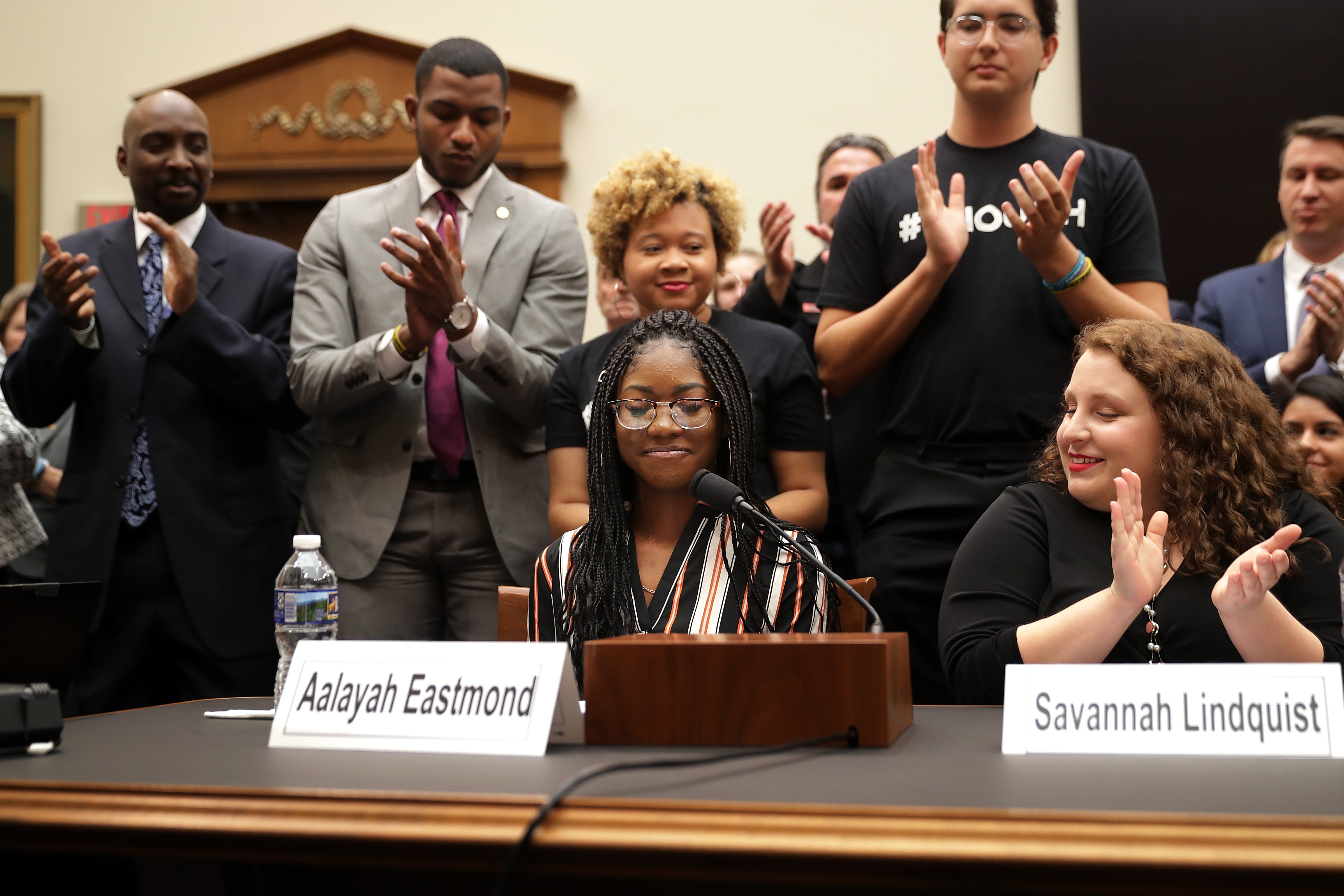 Aalayah Eastmond (C), a survivor of the mass shooting at Marjory Stoneman Douglas High School in Parkland, Florida, receives a standing ovation while testifying to the House Judiciary Committee in the Rayburn House Office Building on Capitol Hill February 06, 2019 in Washington, DC. (Photo by Chip Somodevilla/Getty Images)