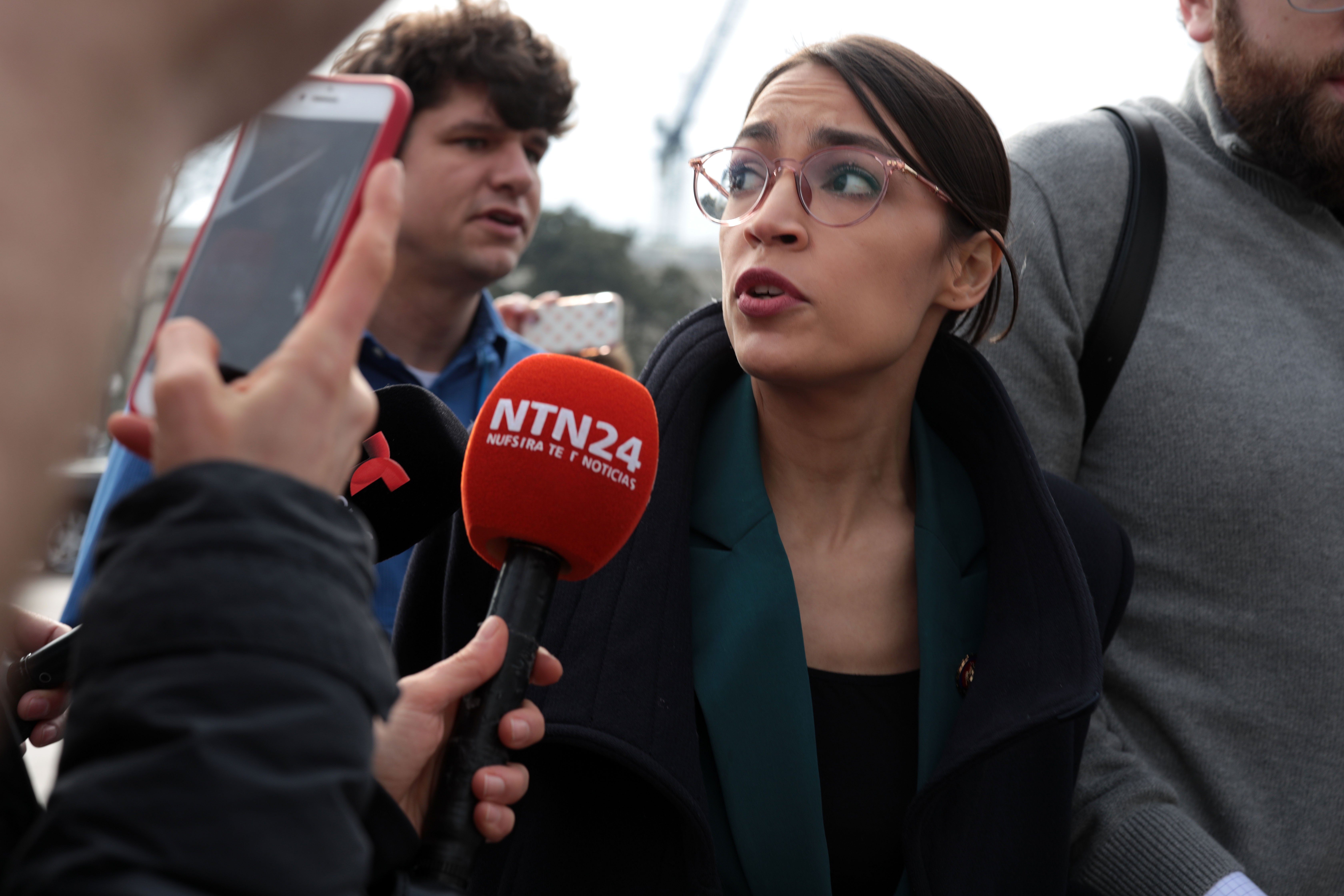 Followed by members of the media, U.S. Rep. Alexandria Ocasio-Cortez leaves a news conference at the East Front of the U.S. Capitol February 7, 2019 in Washington, DC. (Photo by Alex Wong/Getty Images)
