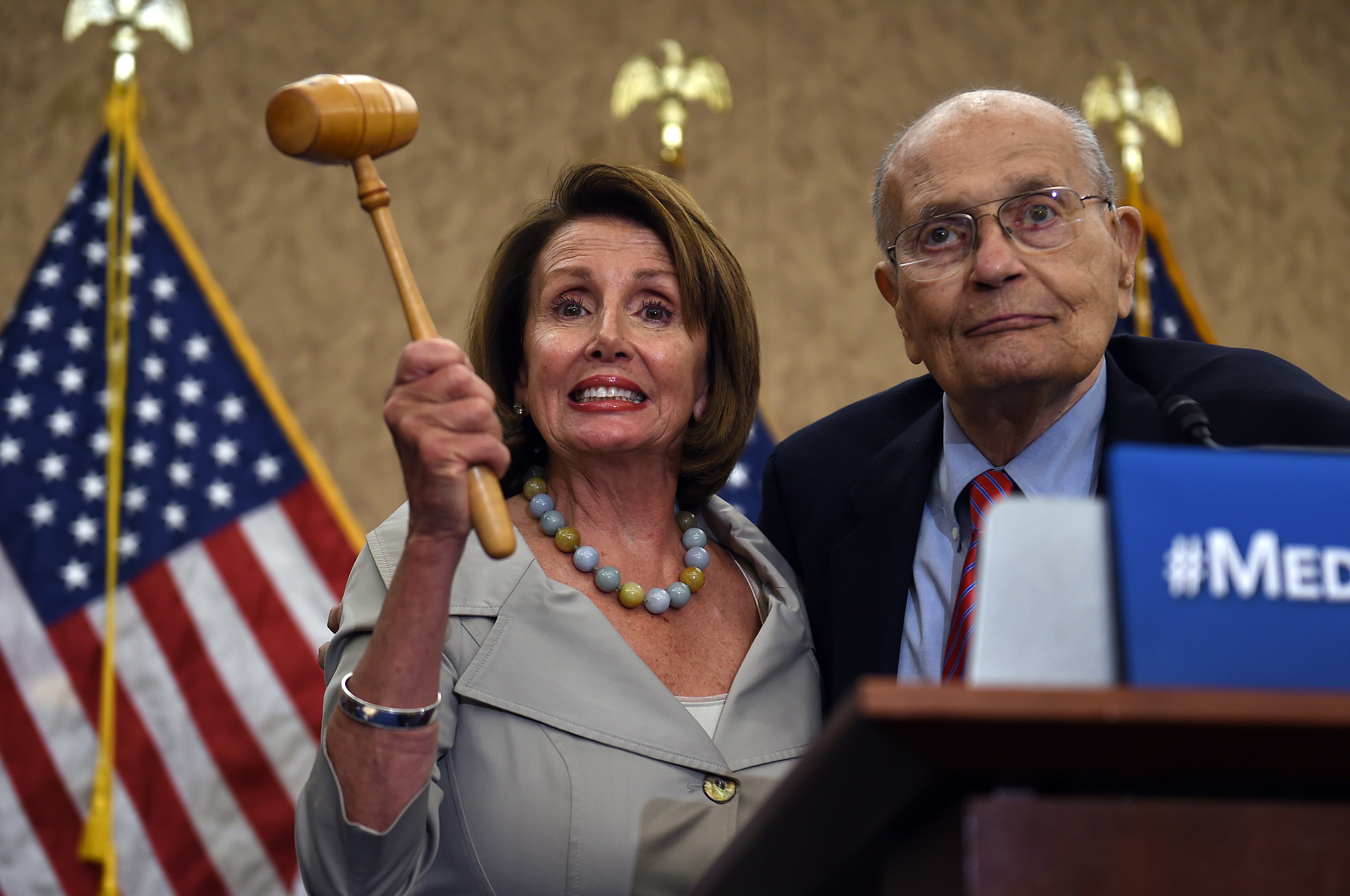 Democratic House Leader Nancy Pelosi, accompanied by former congressman John Dingell, marks the 50th Anniversary of Medicare and Medicaid on Capitol Hill on July 29, 2015 in Washington, DC.(Photo by Astrid Riecken/Getty Images)