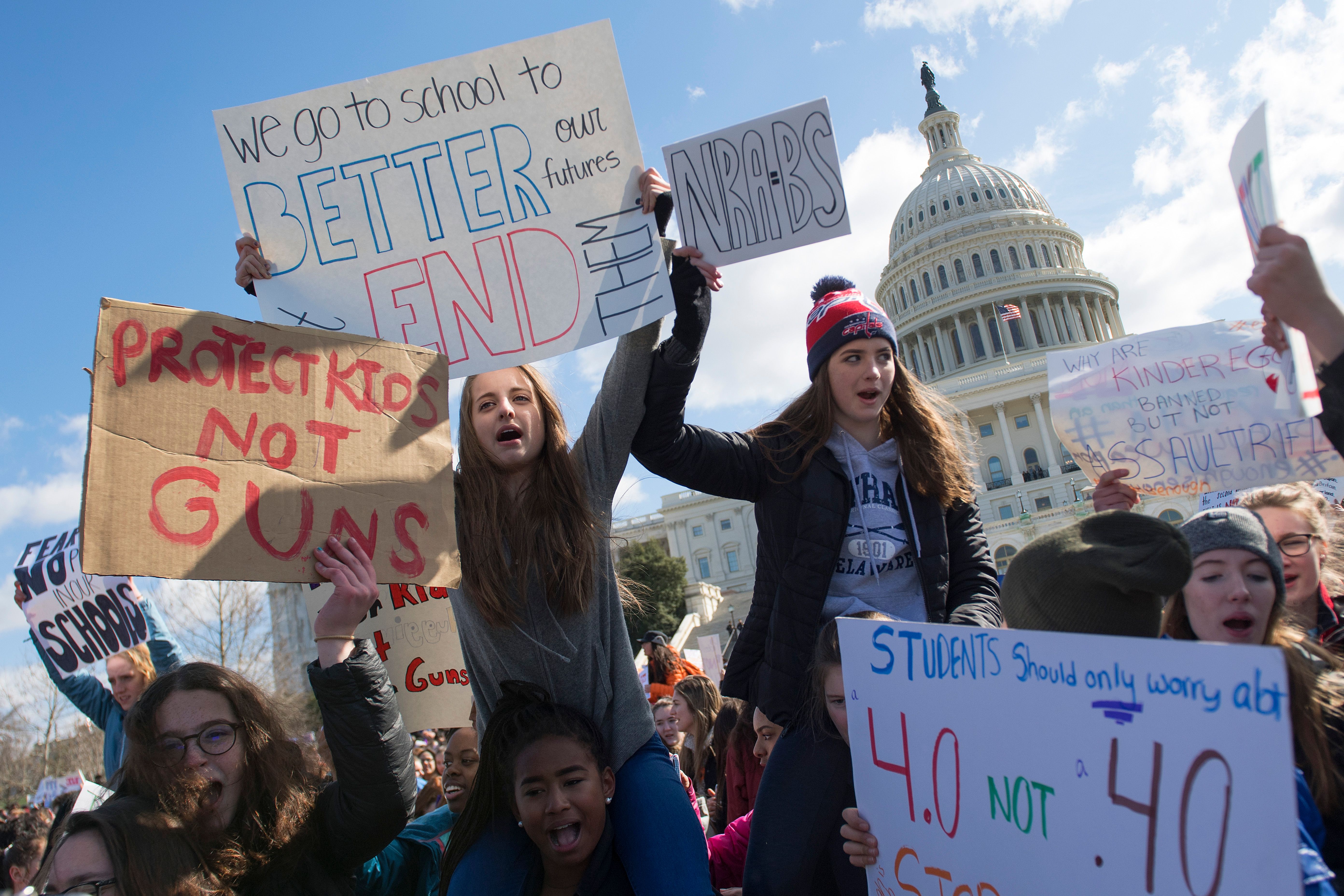 Students participate in a rally with other students from DC ... (Photo credit should read JIM WATSON/AFP/Getty Images)