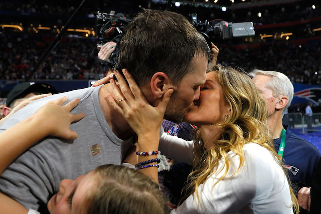 om Brady #12 of the New England Patriots kisses his wife Gisele Bündchen after the Super Bowl LIII against the Los Angeles Rams at Mercedes-Benz Stadium on February 3, 2019 in Atlanta, Georgia. The New England Patriots defeat the Los Angeles Rams 13-3. (Photo by Kevin C. Cox/Getty Images)