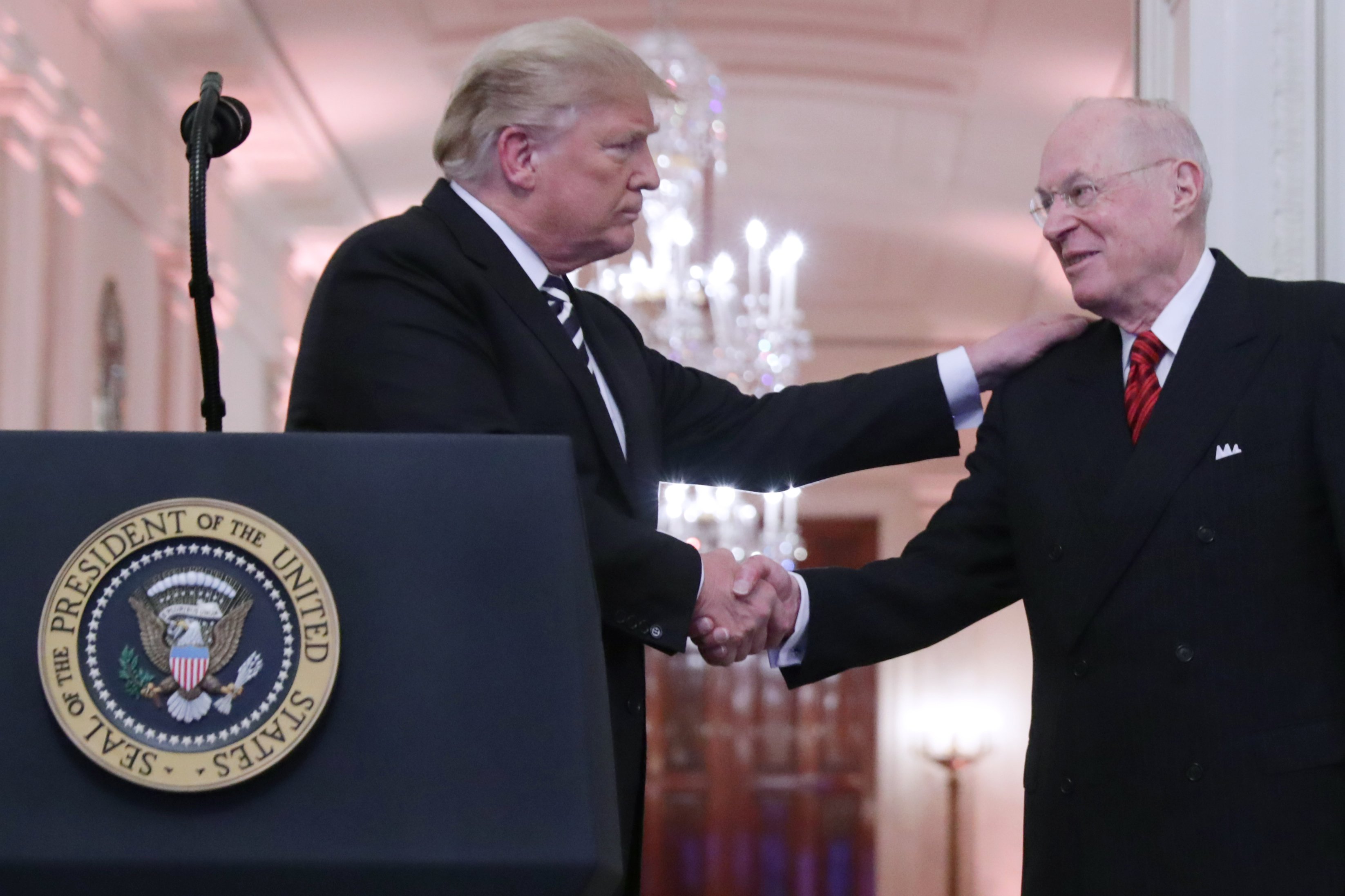 President Donald Trump shakes hands with retired Justice Anthony Kennedy during the ceremonial swearing in of Justice Brett Kavanaugh at the White House on October 8, 2018. (Chip Somodevilla/Getty Images)