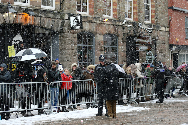People wait for the arrival of Britain's Prince Harry, Duke of Sussex and Meghan, Duchess of Sussex at Bristol Old Vic in Bristol, Britain, February 1, 2019. REUTERS/Tom Jacobs