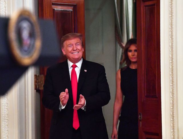 US President Donald Trump and first lady Melania arrive for a White House reception in honor of National African American History Month on February 21, 2019 in Washington, DC. (Photo credit: NICHOLAS KAMM/AFP/Getty Images)