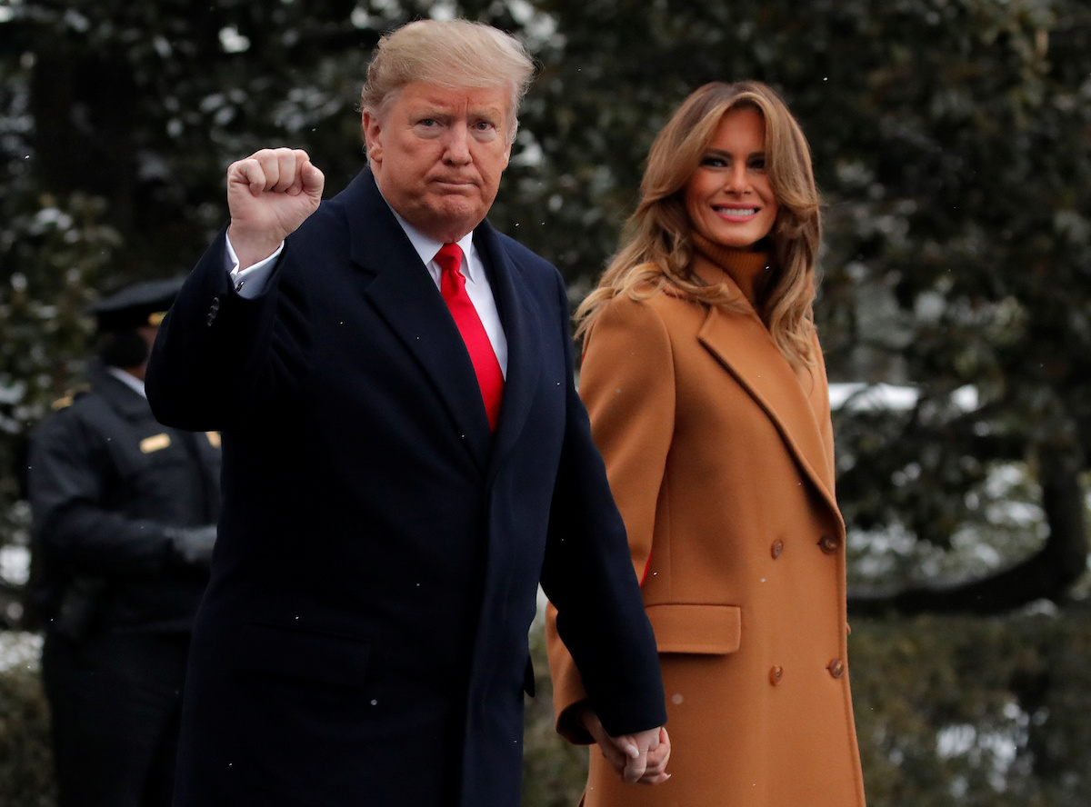 U.S. President Donald Trump walks with first lady Melania Trump while departing for Palm Beach, Florida from the White House in Washington, U.S., February 1, 2019. REUTERS/Jim Young