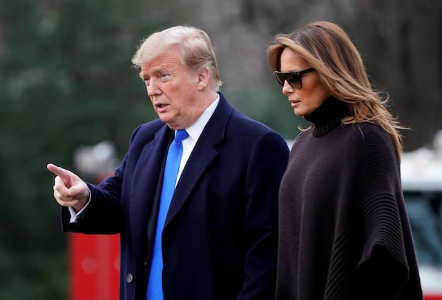 U.S. President Donald Trump and U.S. first lady Melania Trump walk to Marine One as they depart for Palm Beach from the White House in Washington, U.S., February 15, 2019. REUTERS/Joshua Roberts
