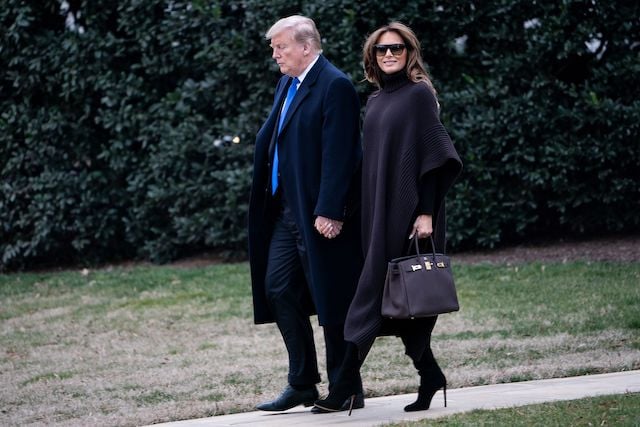 US President Donald Trump and US first lady Melania Trump walk to Marine One on the South Lawn of the White House February 15, 2019 in Washington, DC. - Trump is spending the weekend at his Mar-a-Lago estate in Palm Beach, Florida. (Photo credit: BRENDAN SMIALOWSKI/AFP/Getty Images)