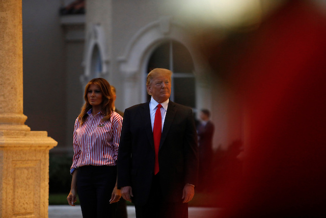 U.S. President Donald Trump and first lady Melania Trump watch the Florida Atlantic University Marching Band during a Super Bowl LIII party at Trump International Golf Course in West Palm Beach, Florida, U.S., February 3, 2019. REUTERS/Eric Thayer